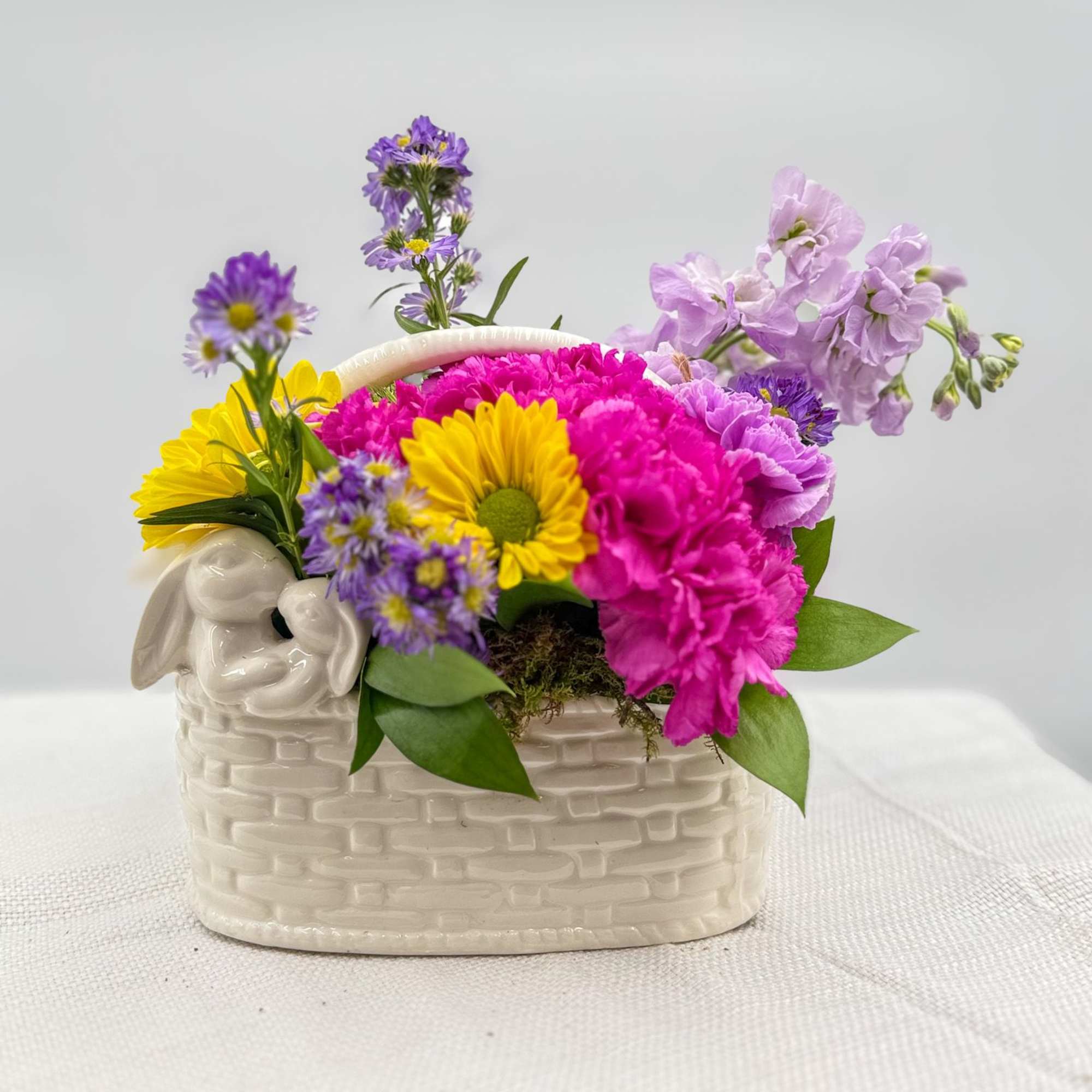 Easter flowers will be used to fill this keepsake bunny basket or