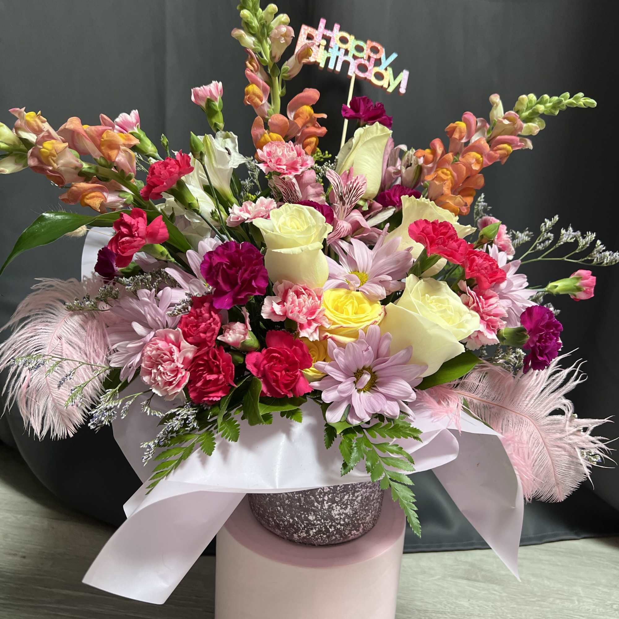 Celebrate in full colour with this joyful floral arrangement, designed to brighten
