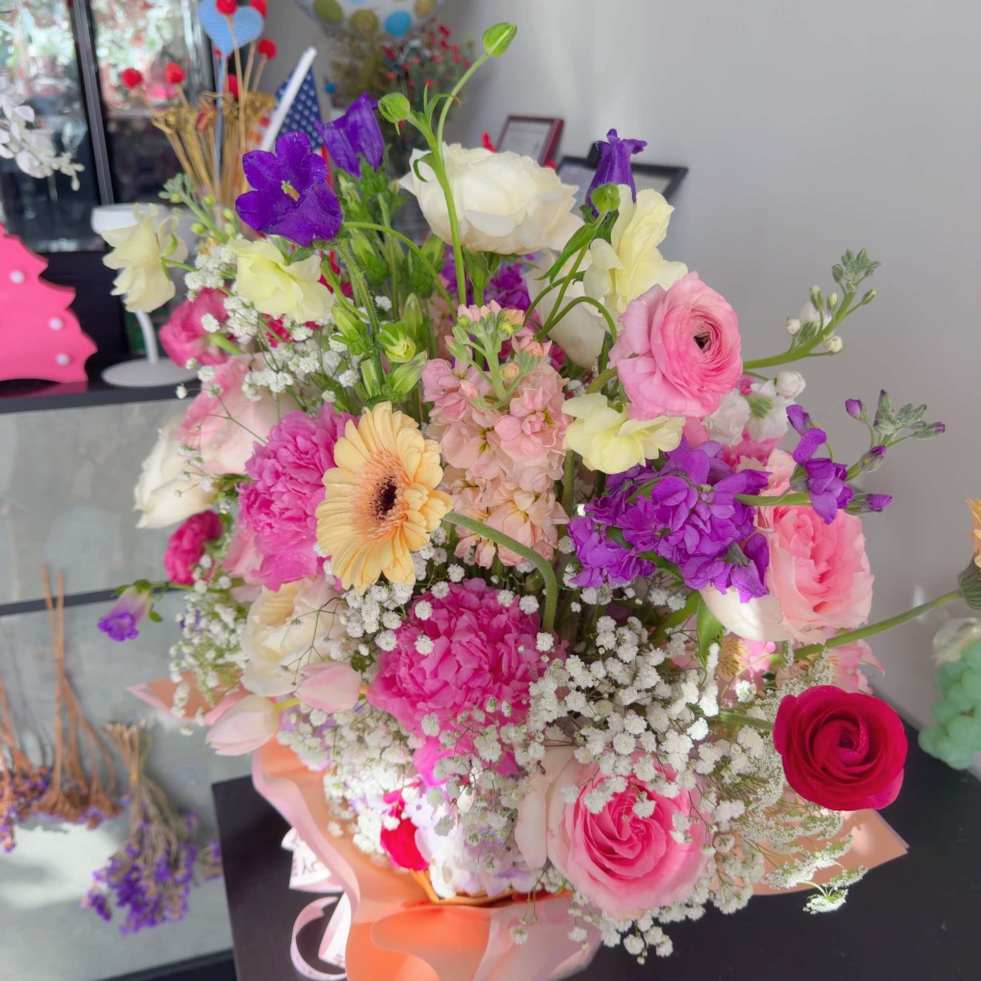 This elegant double-sided floral basket arrangement is designed to be admired from