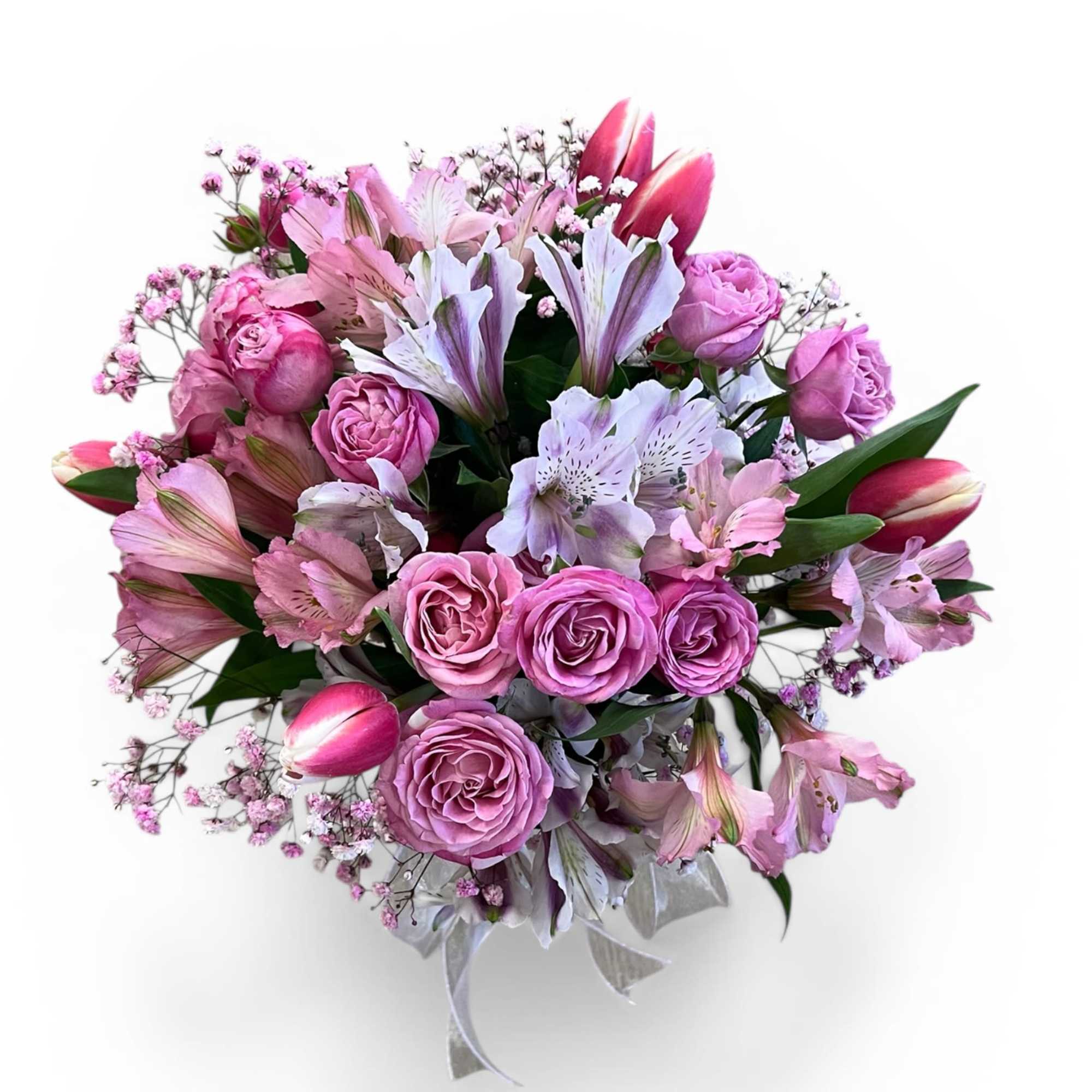 Soft romance in full bloom 

This elegant vase arrangement features lush pink