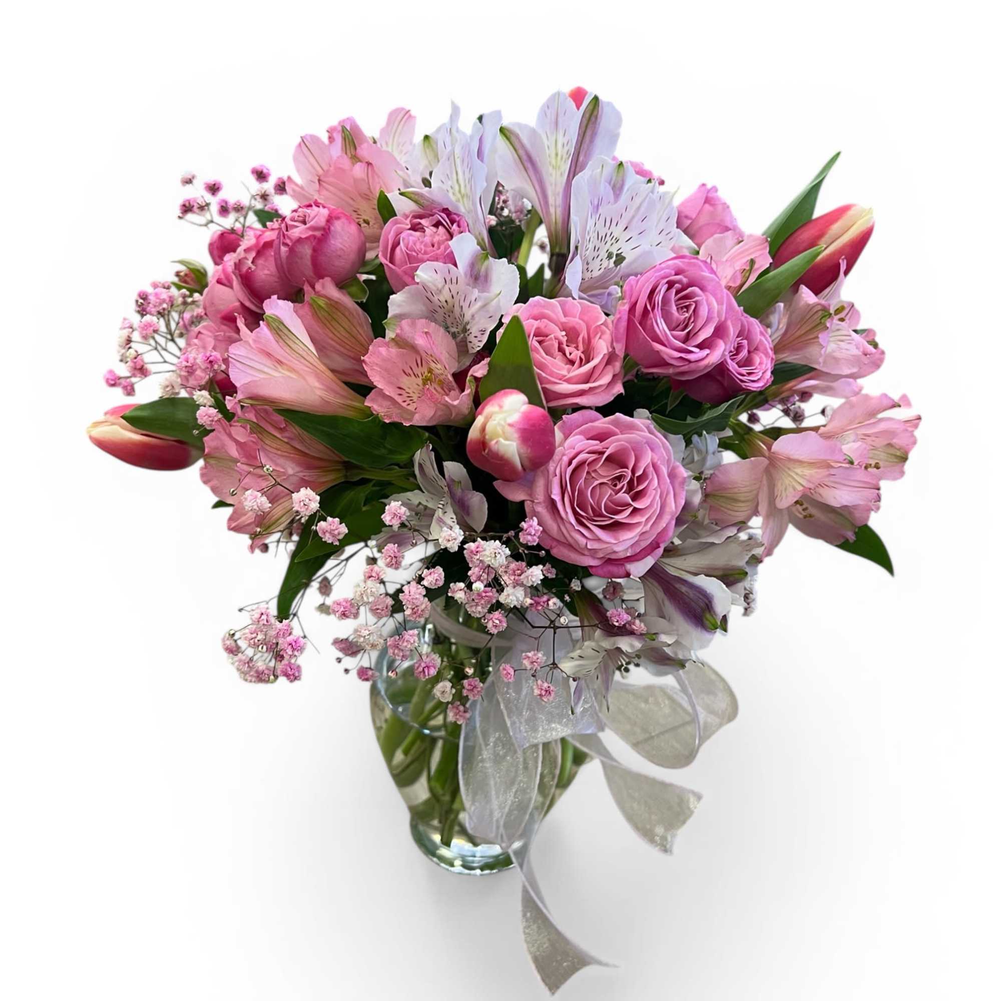 Soft romance in full bloom 

This elegant vase arrangement features lush pink