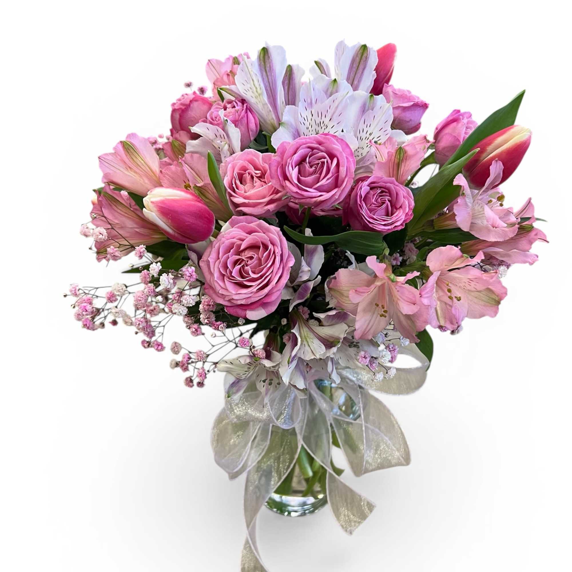 Soft romance in full bloom 

This elegant vase arrangement features lush pink