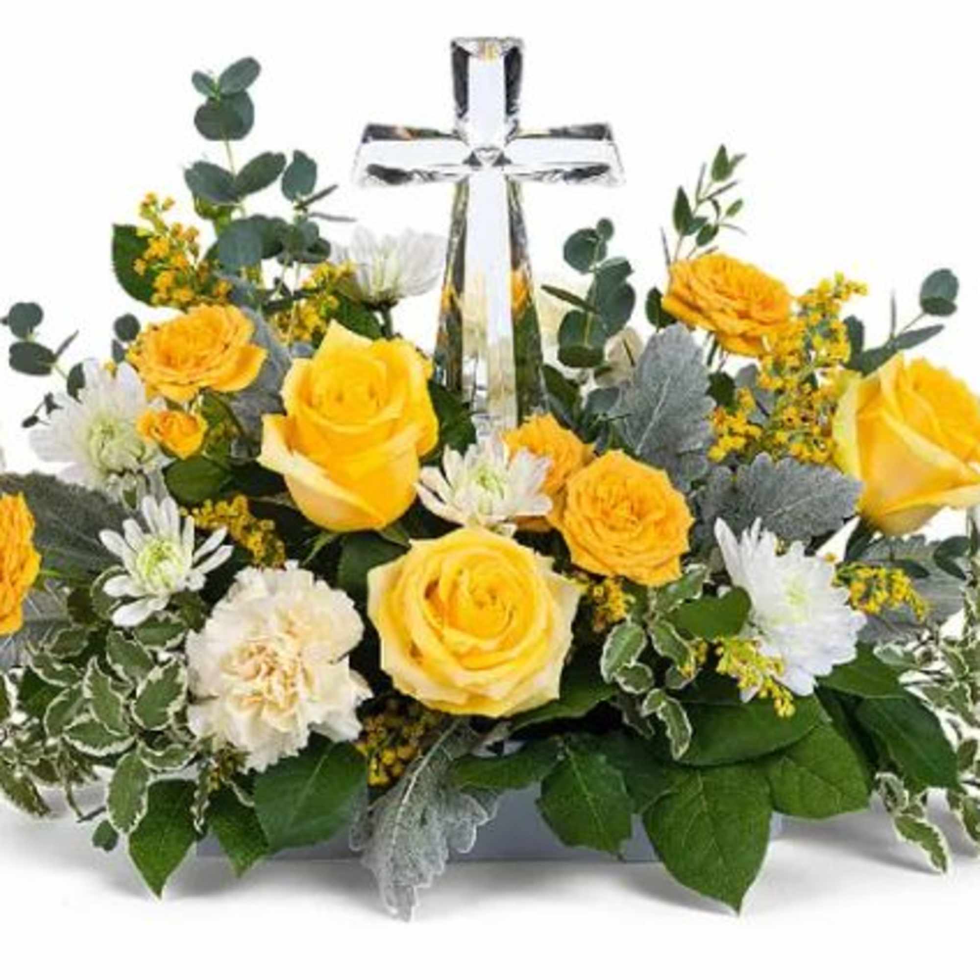 A crystal cross centerpiece is surrounded by the soft glow of yellow