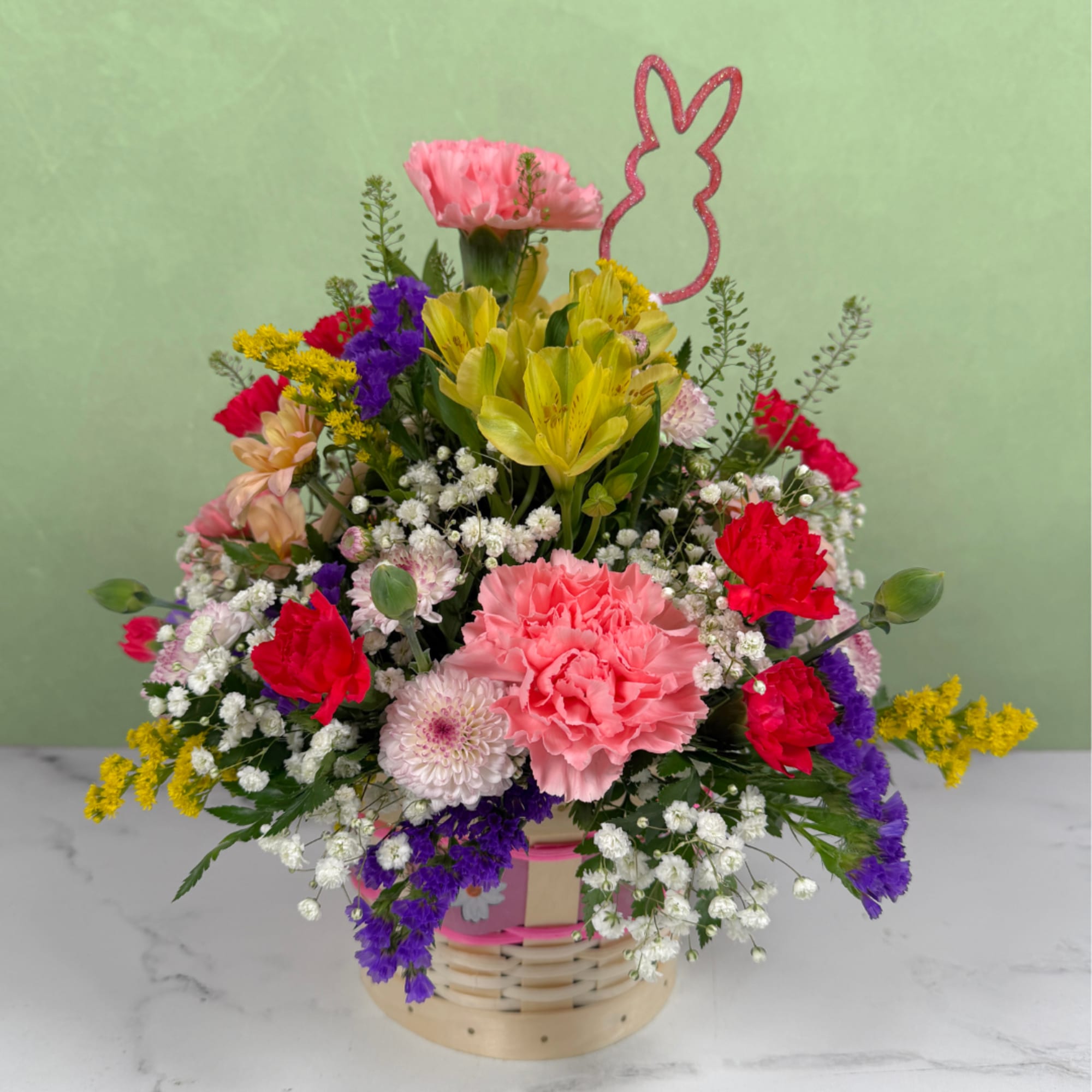 The Easter Wishes Basket by Savilles Florist is a delightful display of
