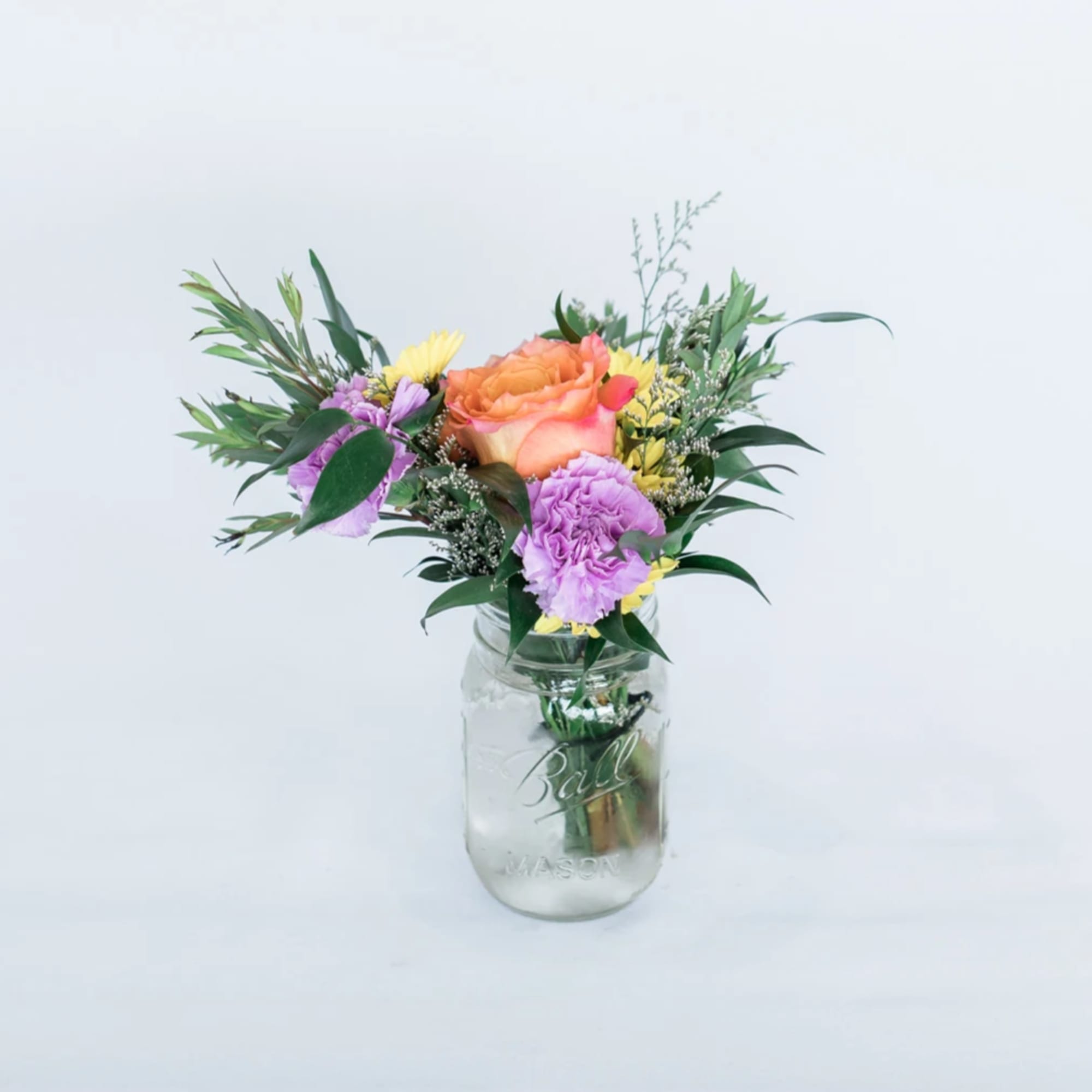 The Seasonal Mason Jar comes arranged with a beautiful mix of seasonal
