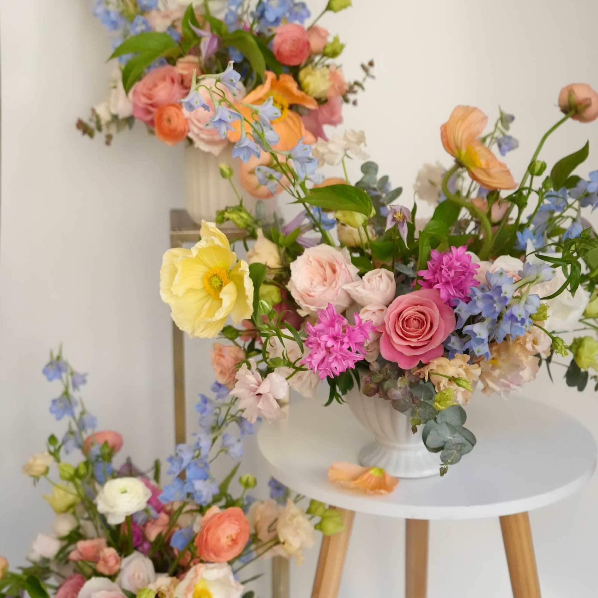 An airy garden arrangement filled with soft pastel blooms and delicate movement.