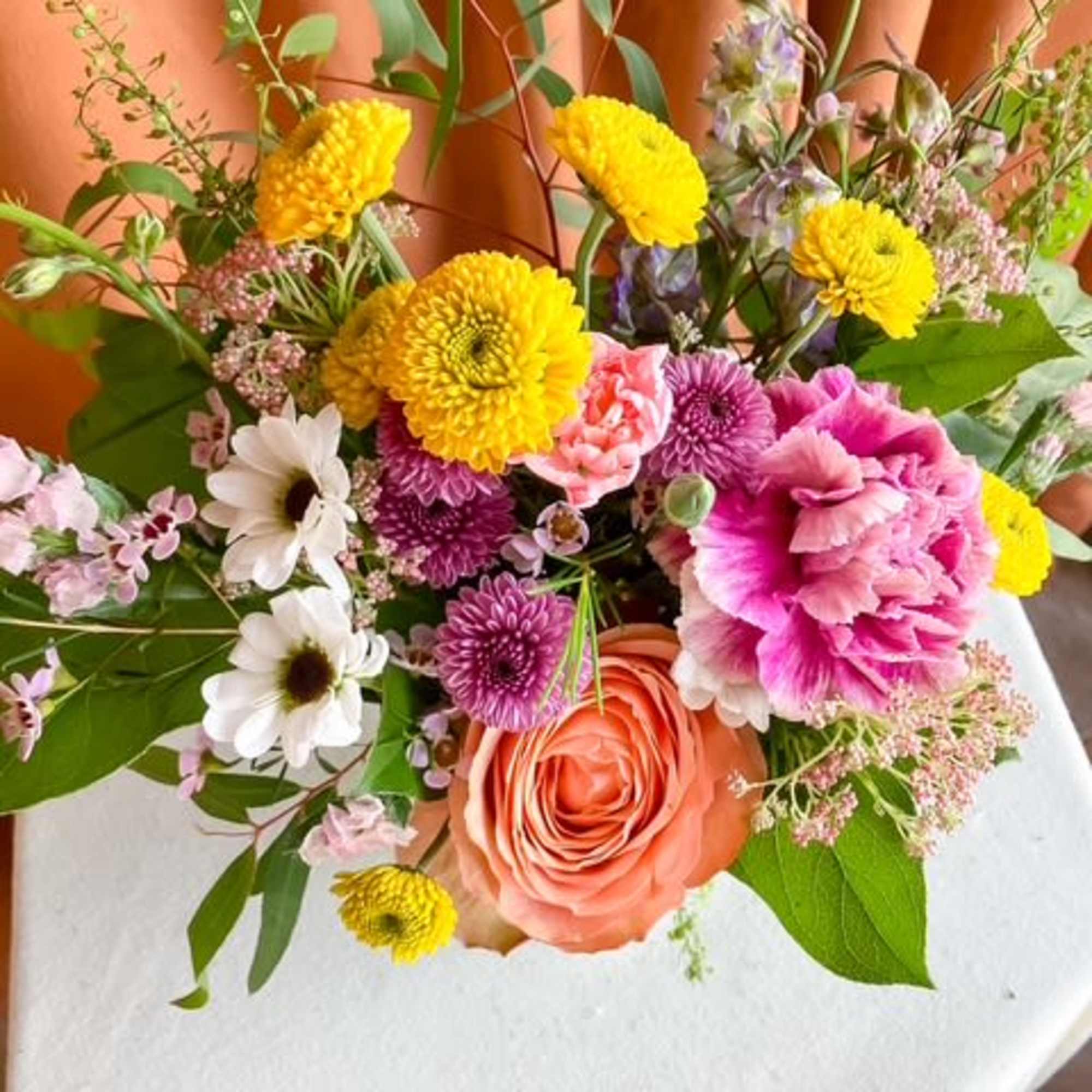 First Bloom is a designer's choice arrangement that captures the untamed beauty