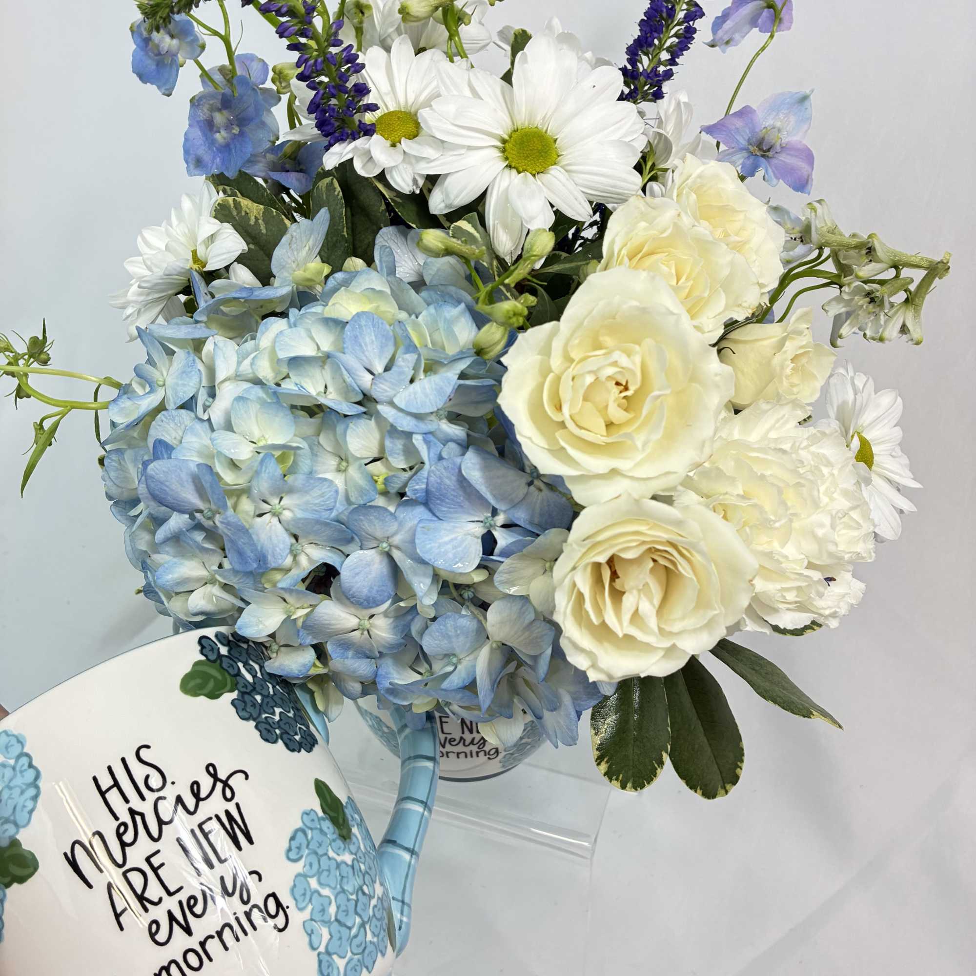 This beautiful fresh arrangement comes in this keepsake, ceramic mug from GloryHaus