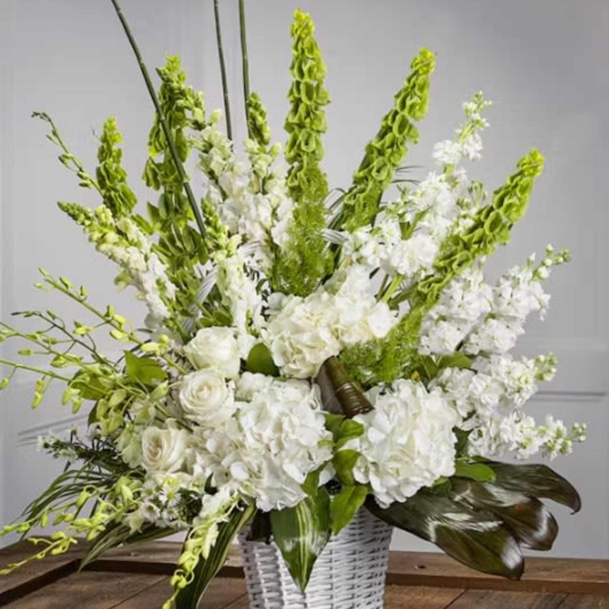 Out White Garden Sympathy Basket features the finest fresh seasonal varieties including