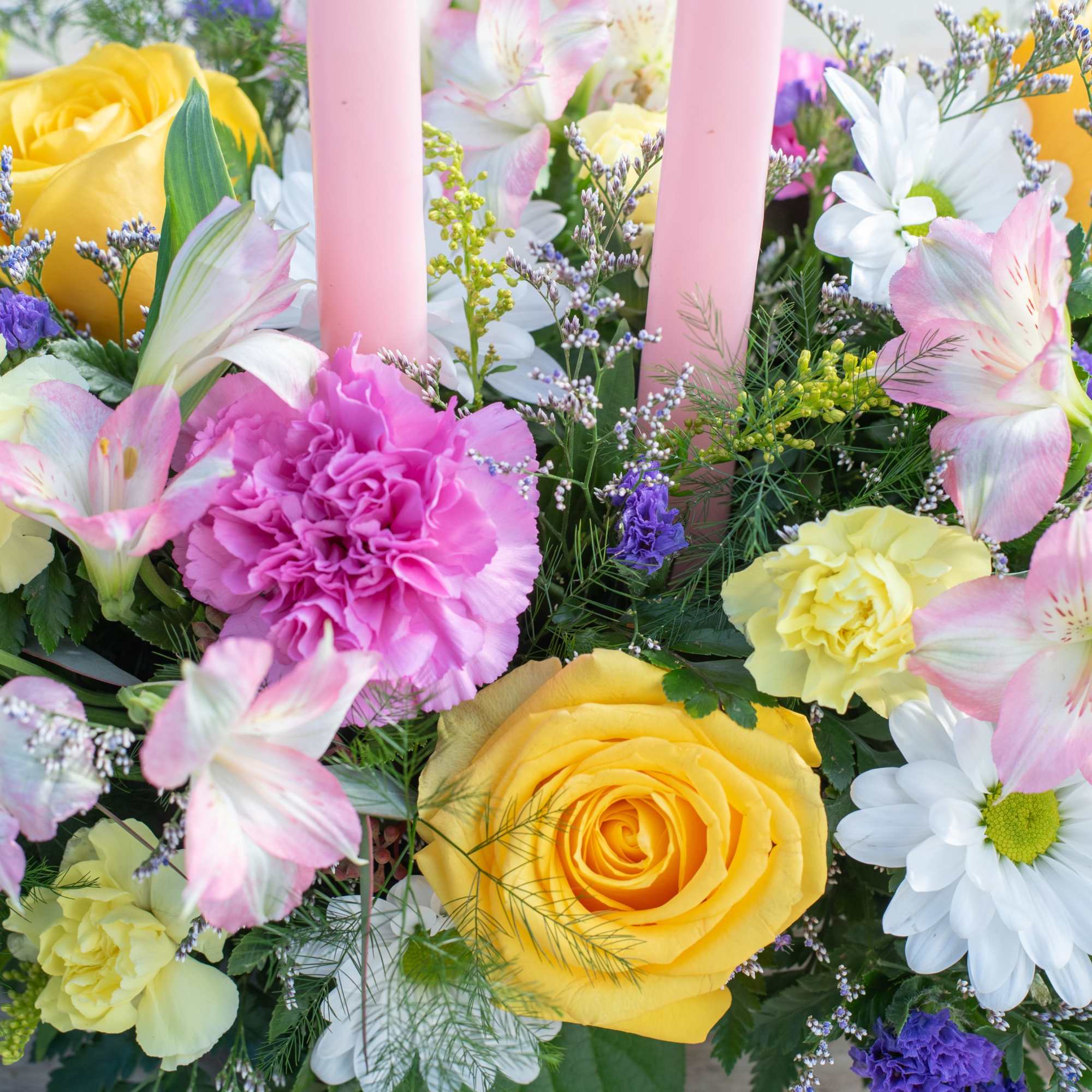 Lovely long and low centerpiece topped with two taper candles. Perfect for