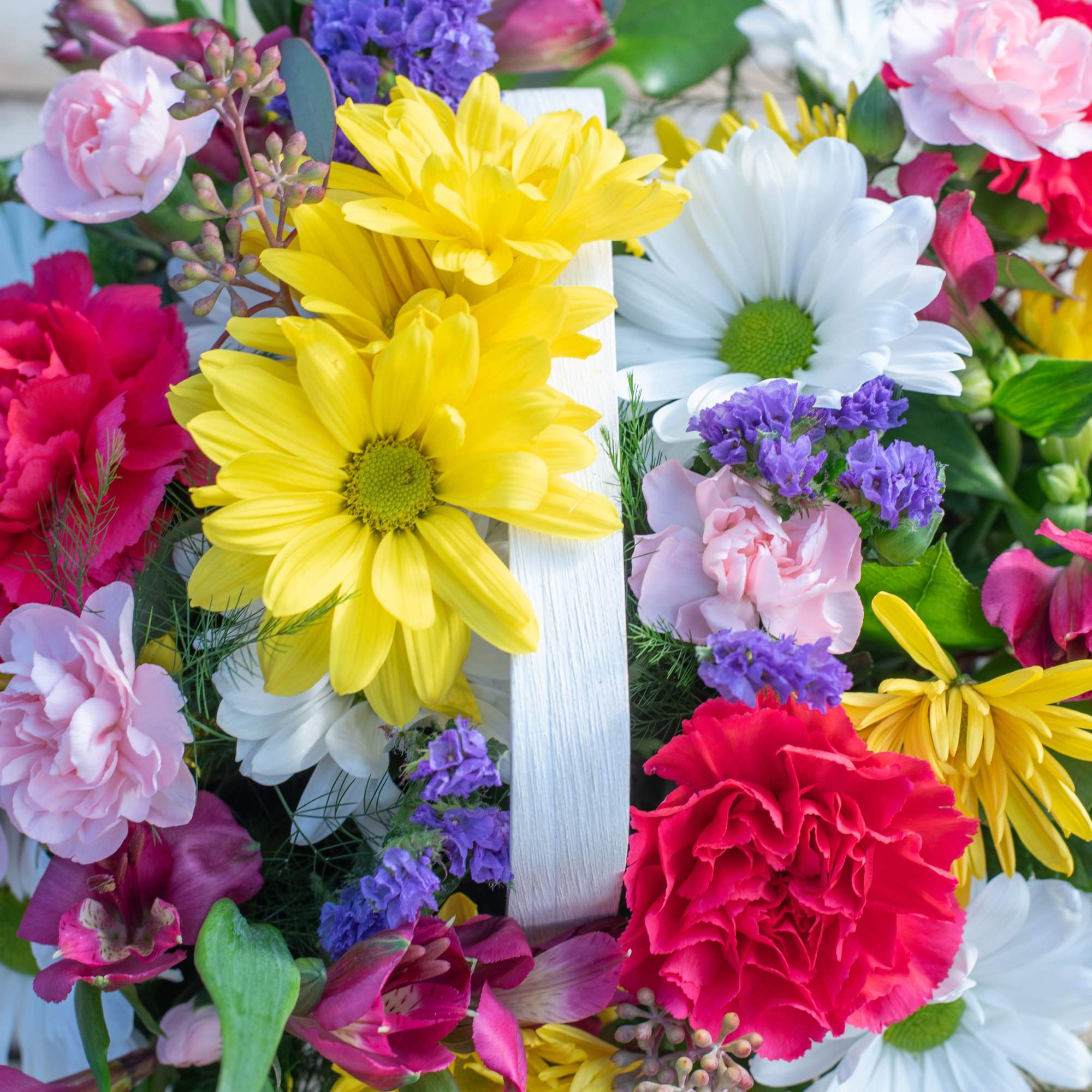 Get ready for the season with this basket full of Spring Blooms