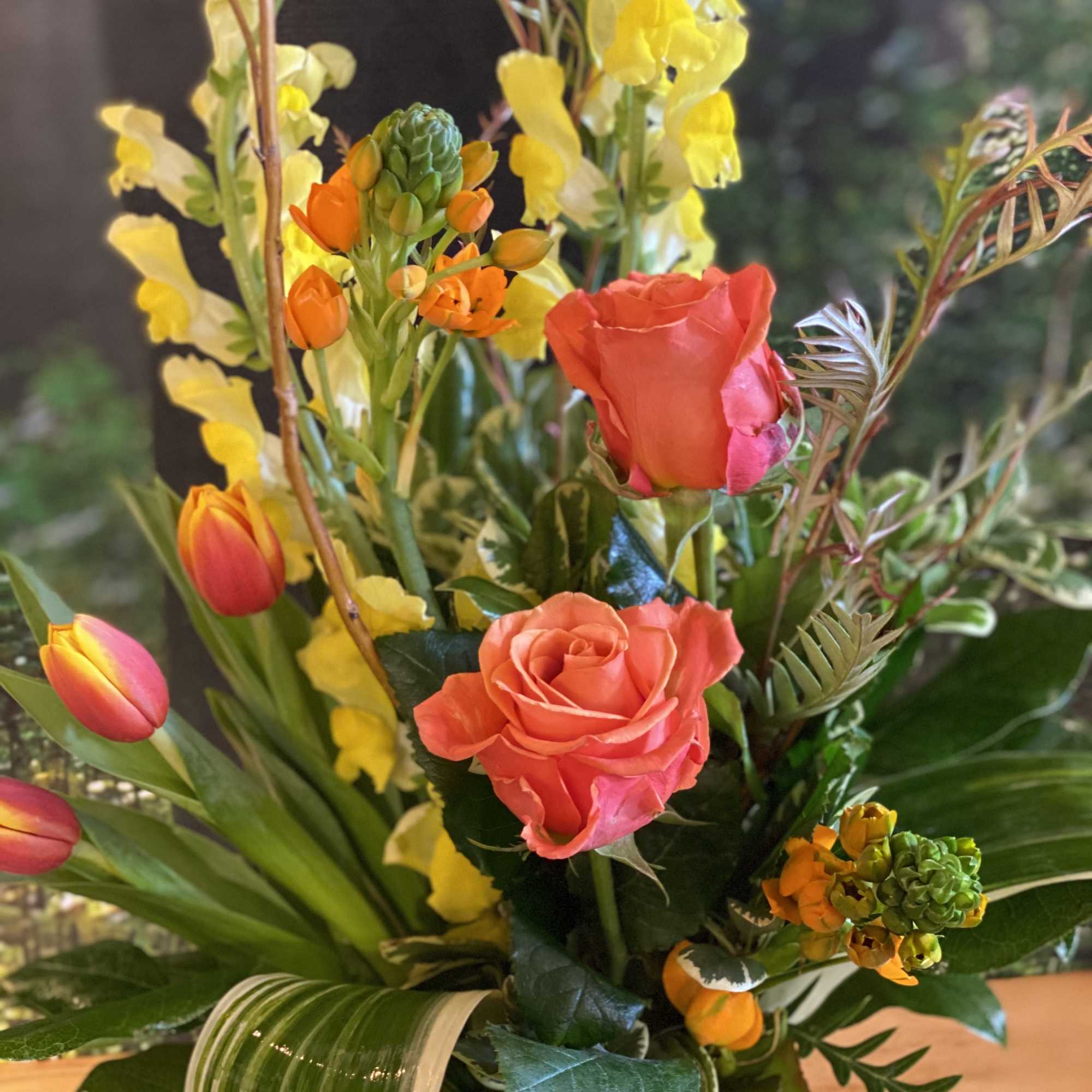 Send Spring Sunshine! Orange, Yellow and Green flowers in a naturalistic modern