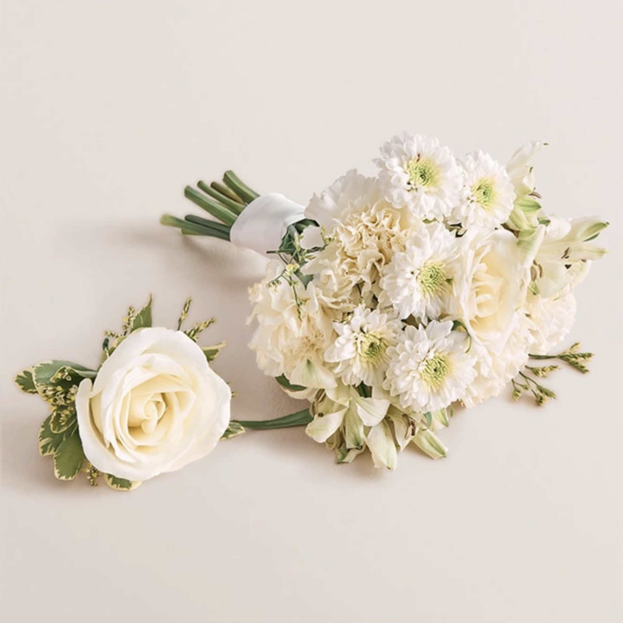 A beautifully coordinated bouquet and boutonniere set designed to complement each other