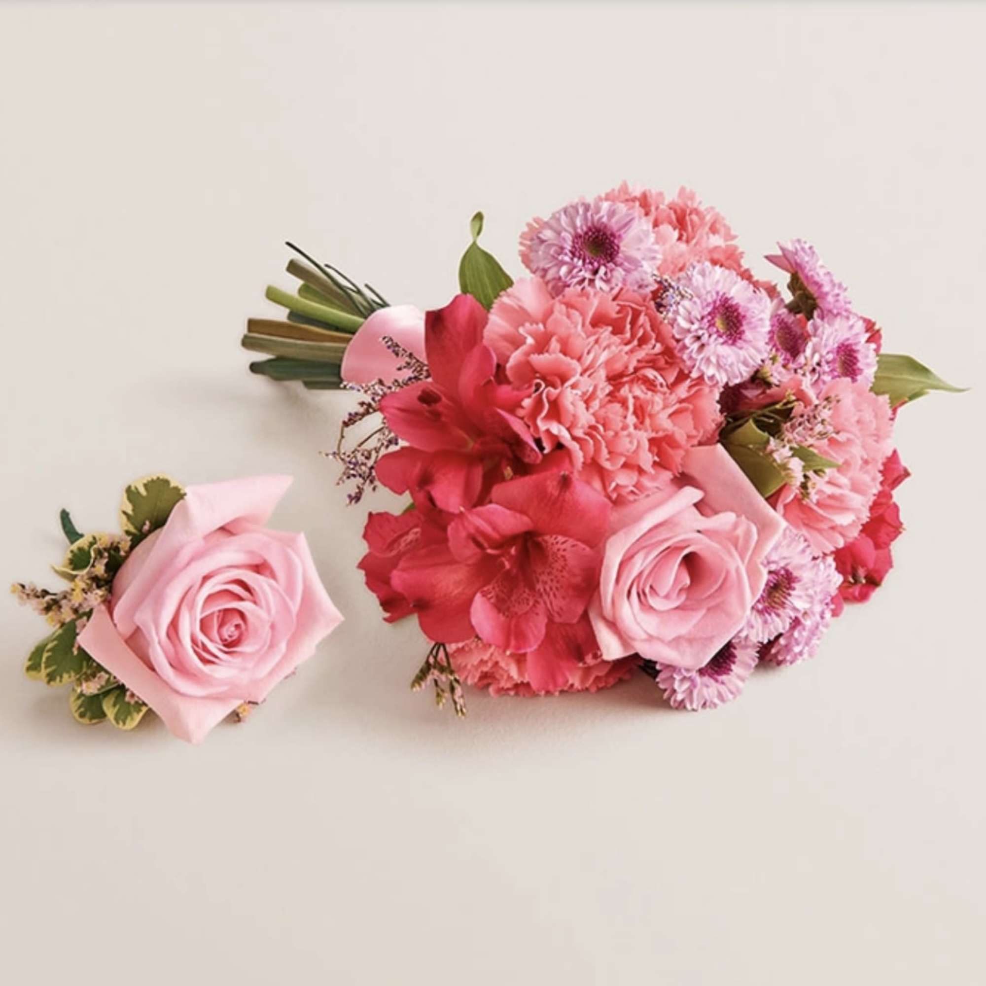 A beautifully coordinated bouquet and boutonniere set designed to complement each other