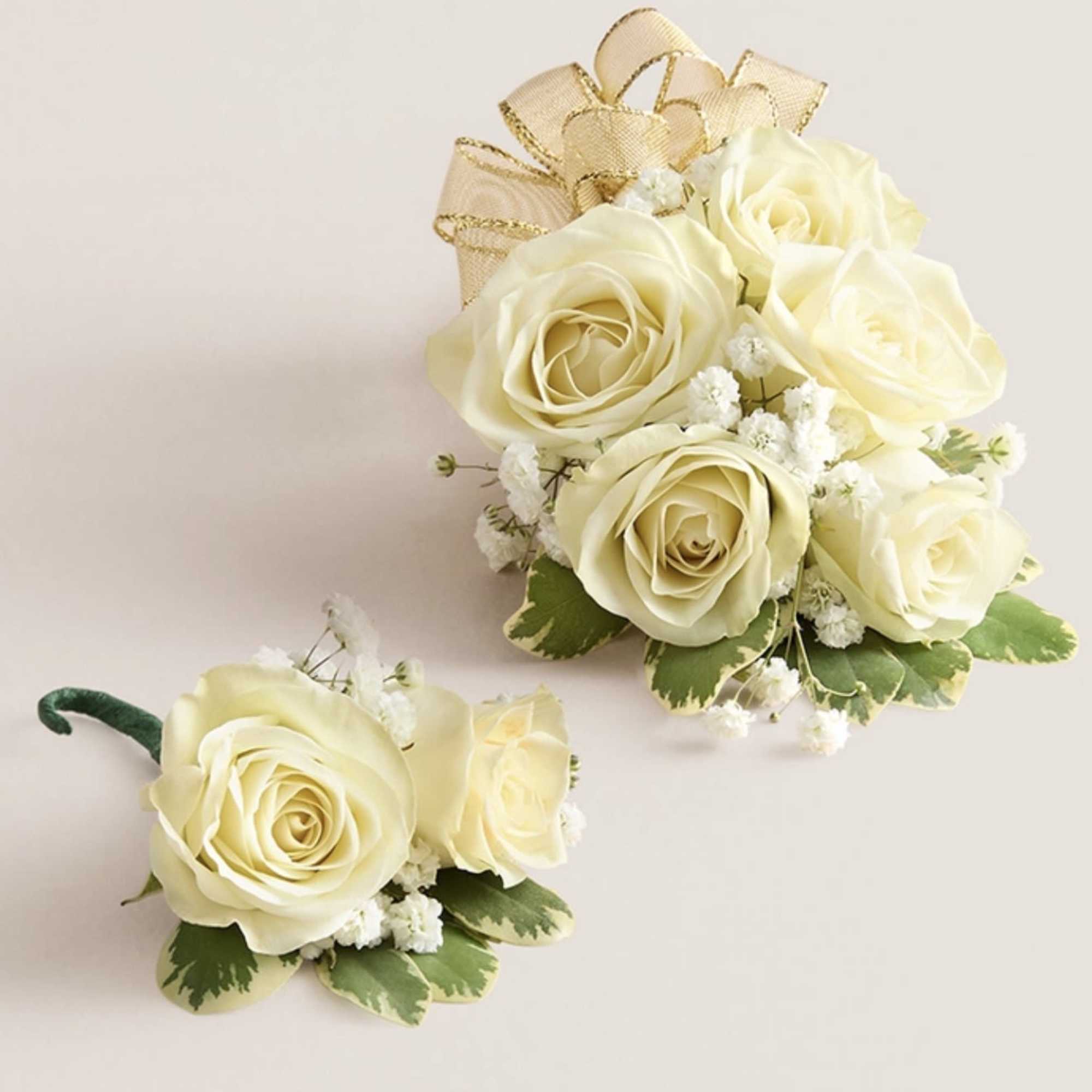 This elegant corsage and boutonniere set is thoughtfully designed to pair perfectly