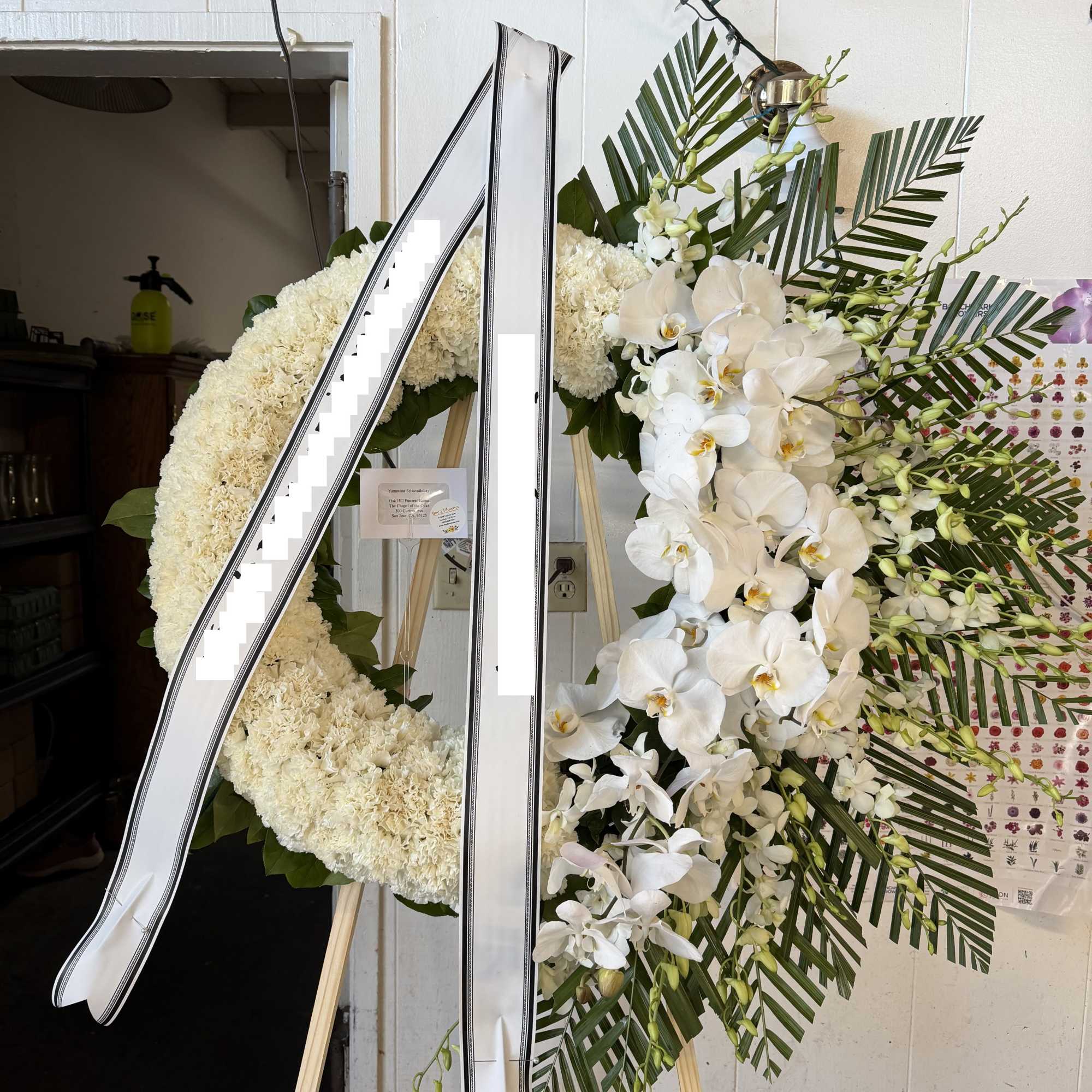 24 Inch Wreath with white orchids , carnations, and gladiolus 