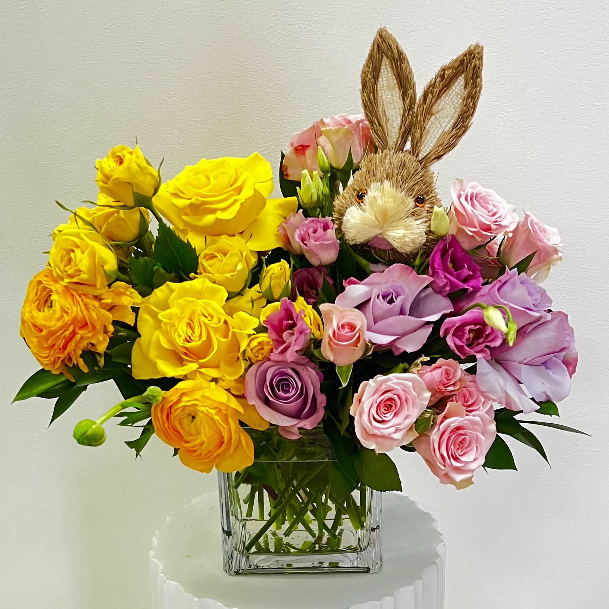 This cute arrangement makes a perfect gift for Easter, with yellow spray