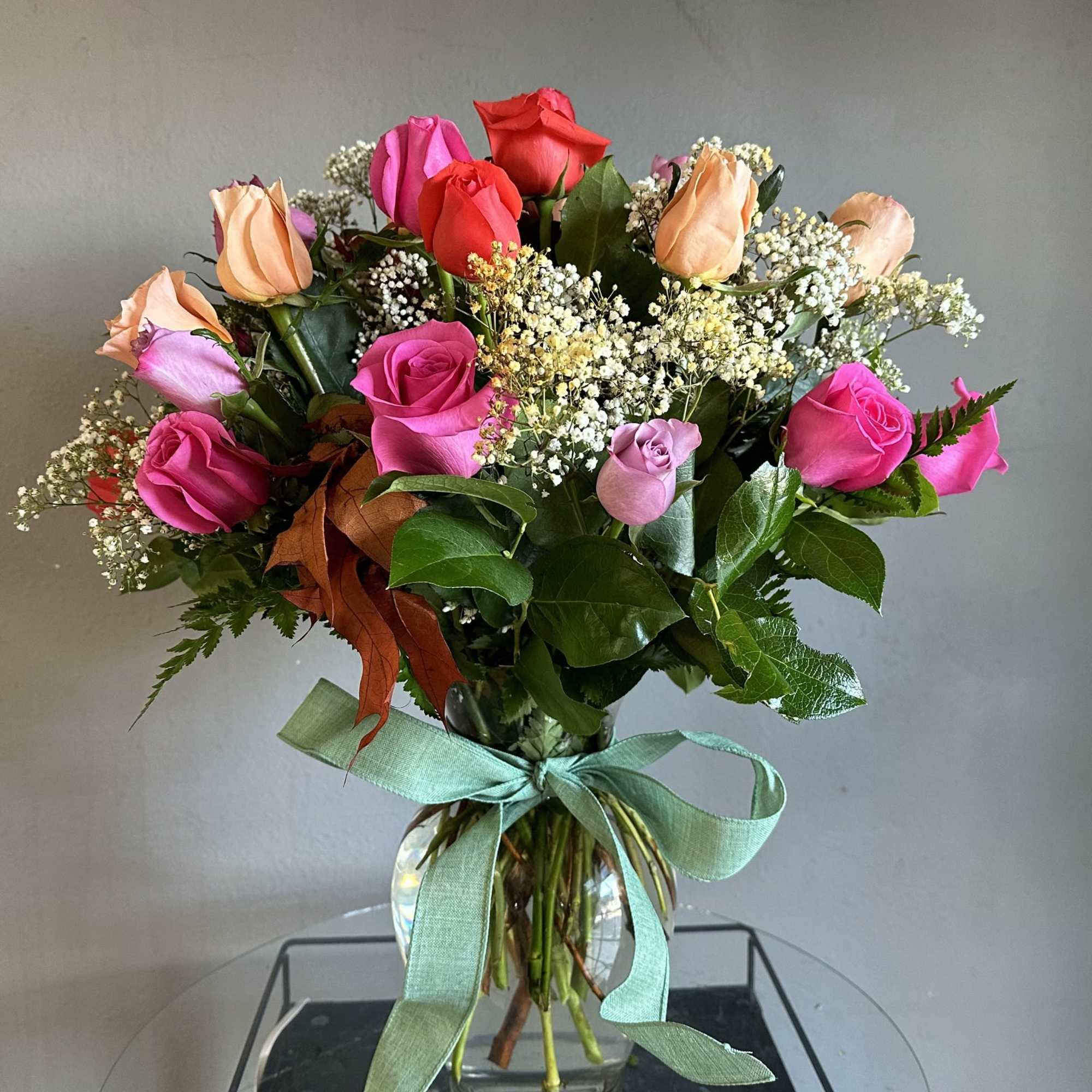 An impressive arrangement of 2, 3 or 4 dozen mixed color roses