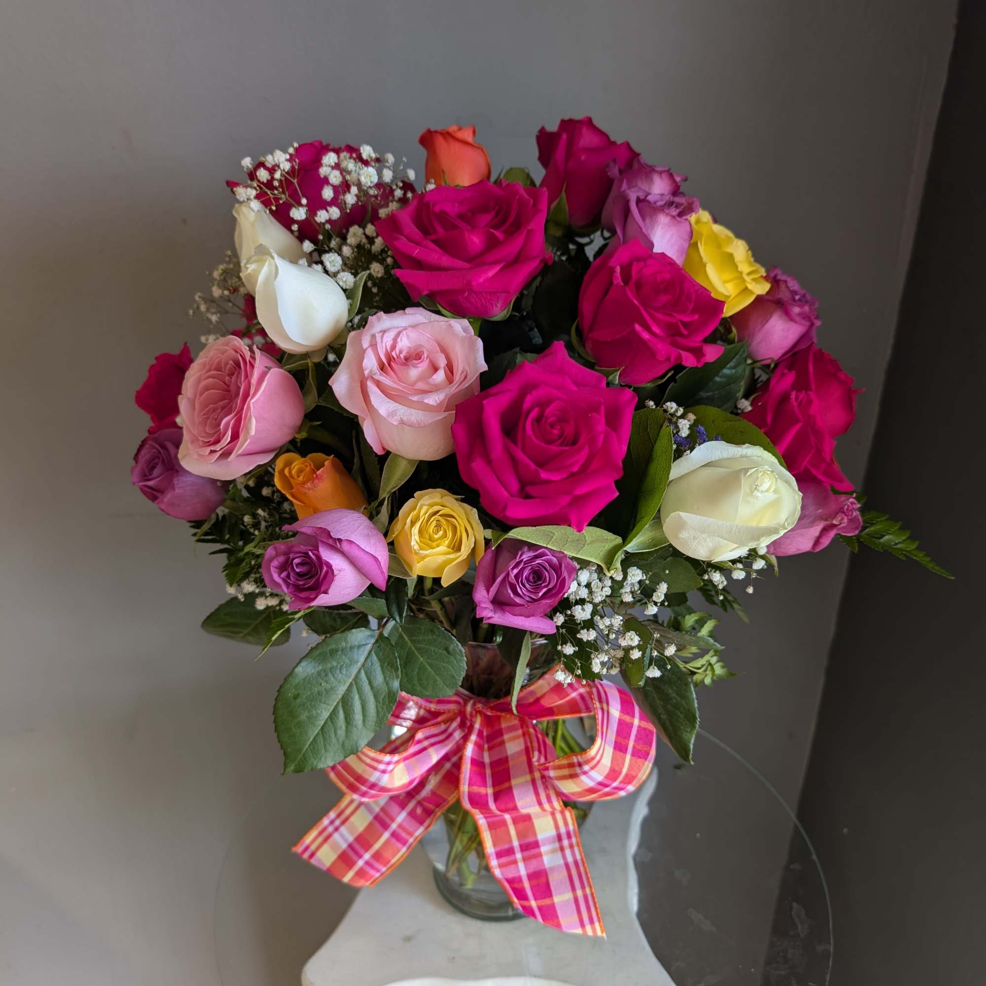 An impressive arrangement of 2, 3 or 4 dozen mixed color roses