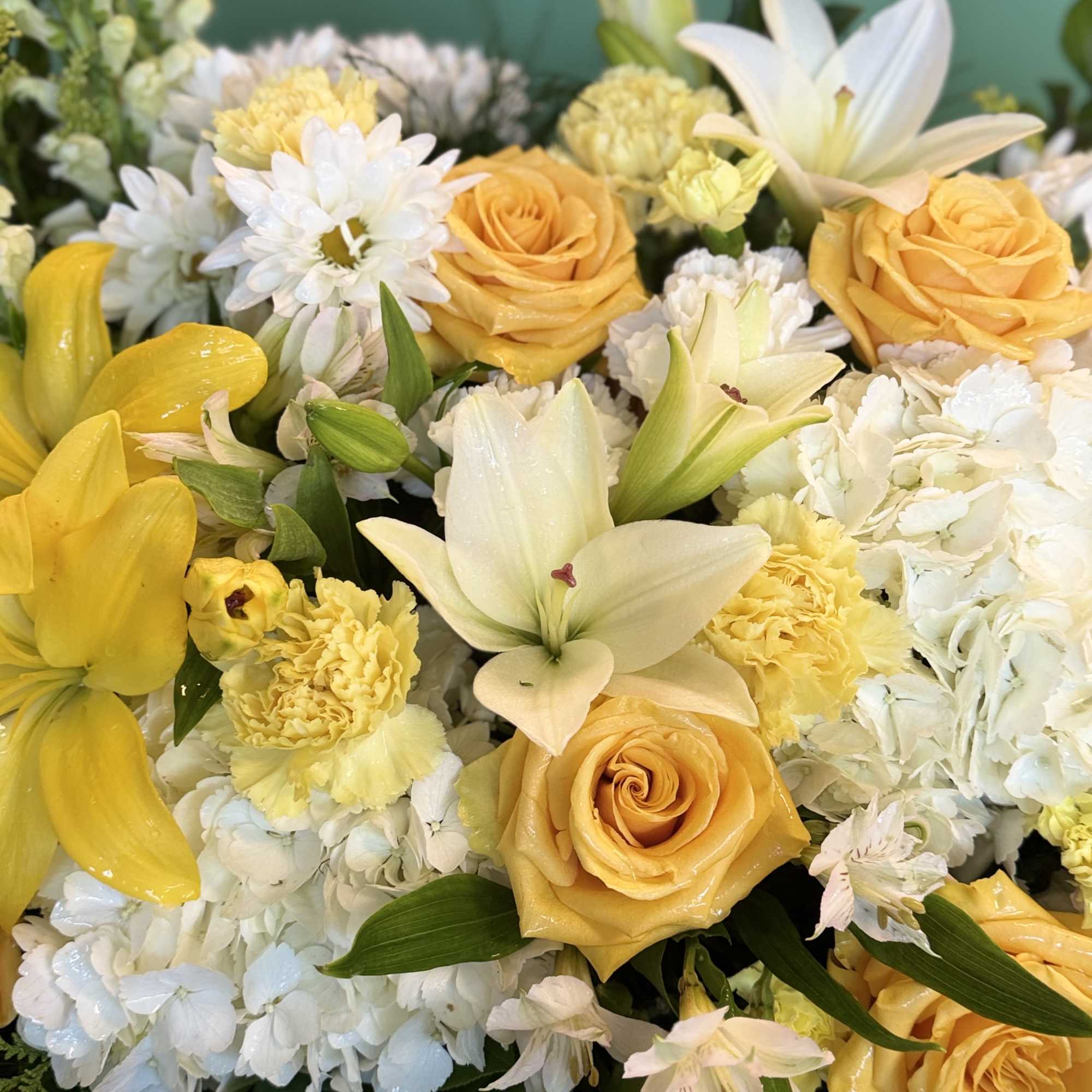 A woven basket overflows with a cheerful arrangement of yellow and white
