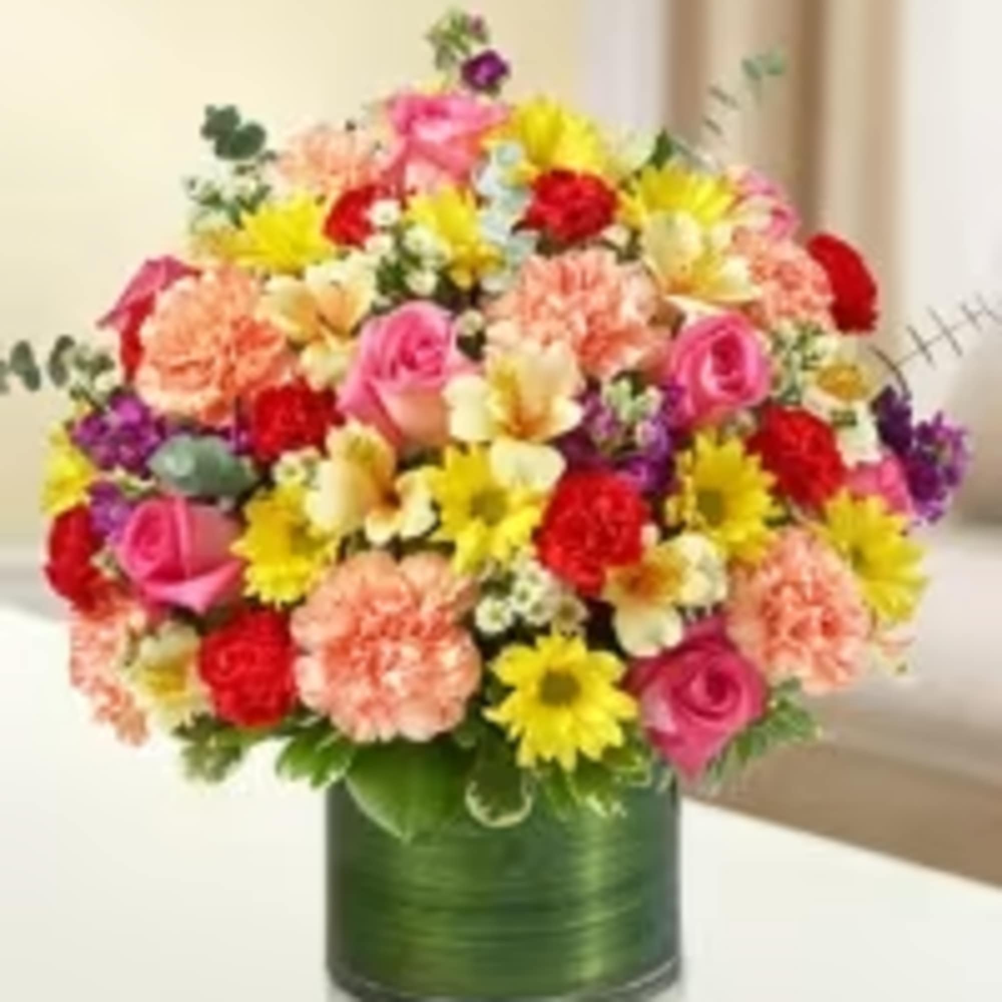 A bright and cheerful arrangement that captures the vibrant colors of spring.