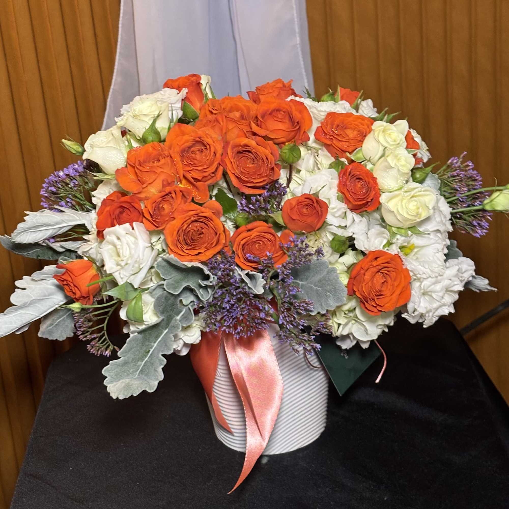 A modern and elegant floral arrangement designed to bring calm beauty and