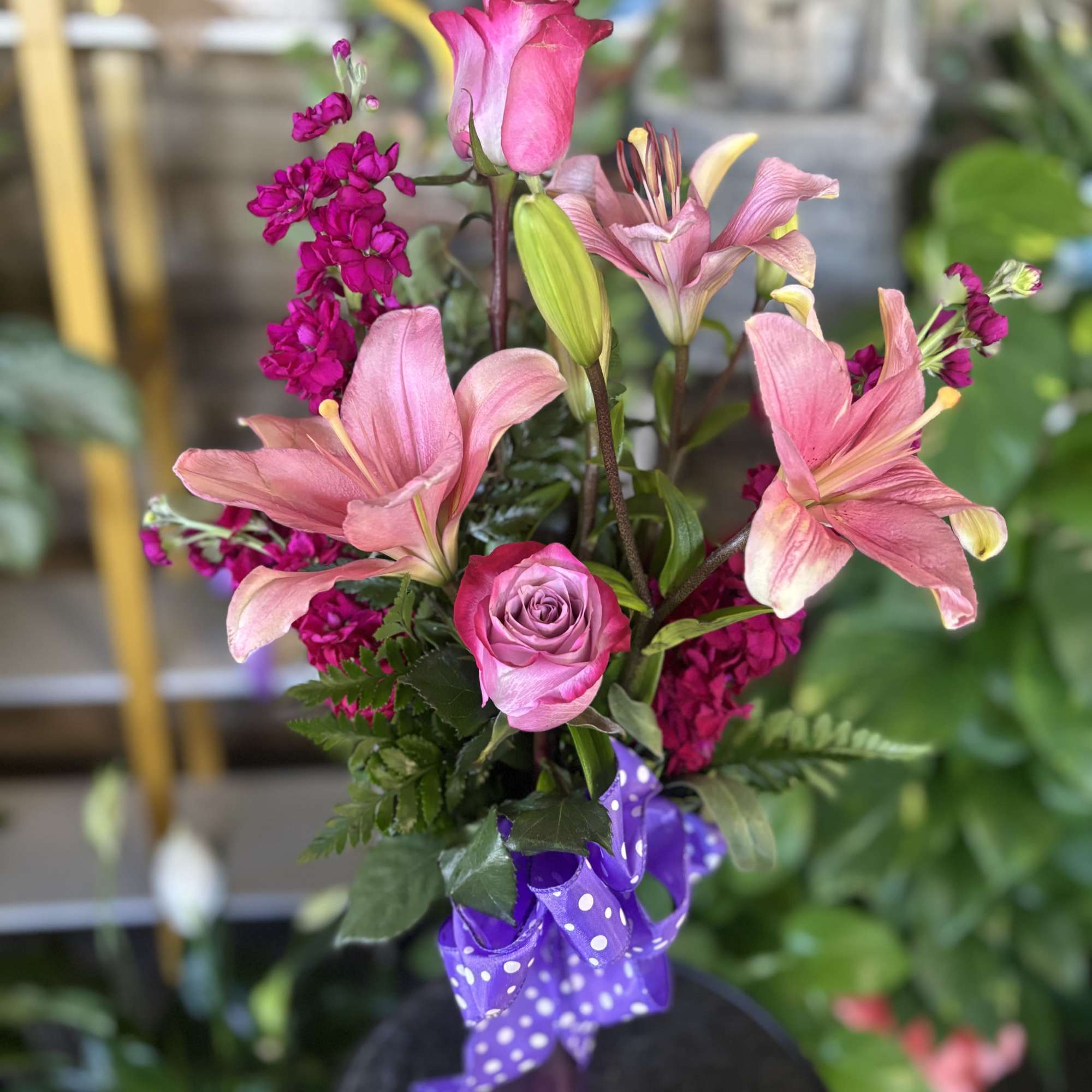 Fresh flowers in long bud vase 