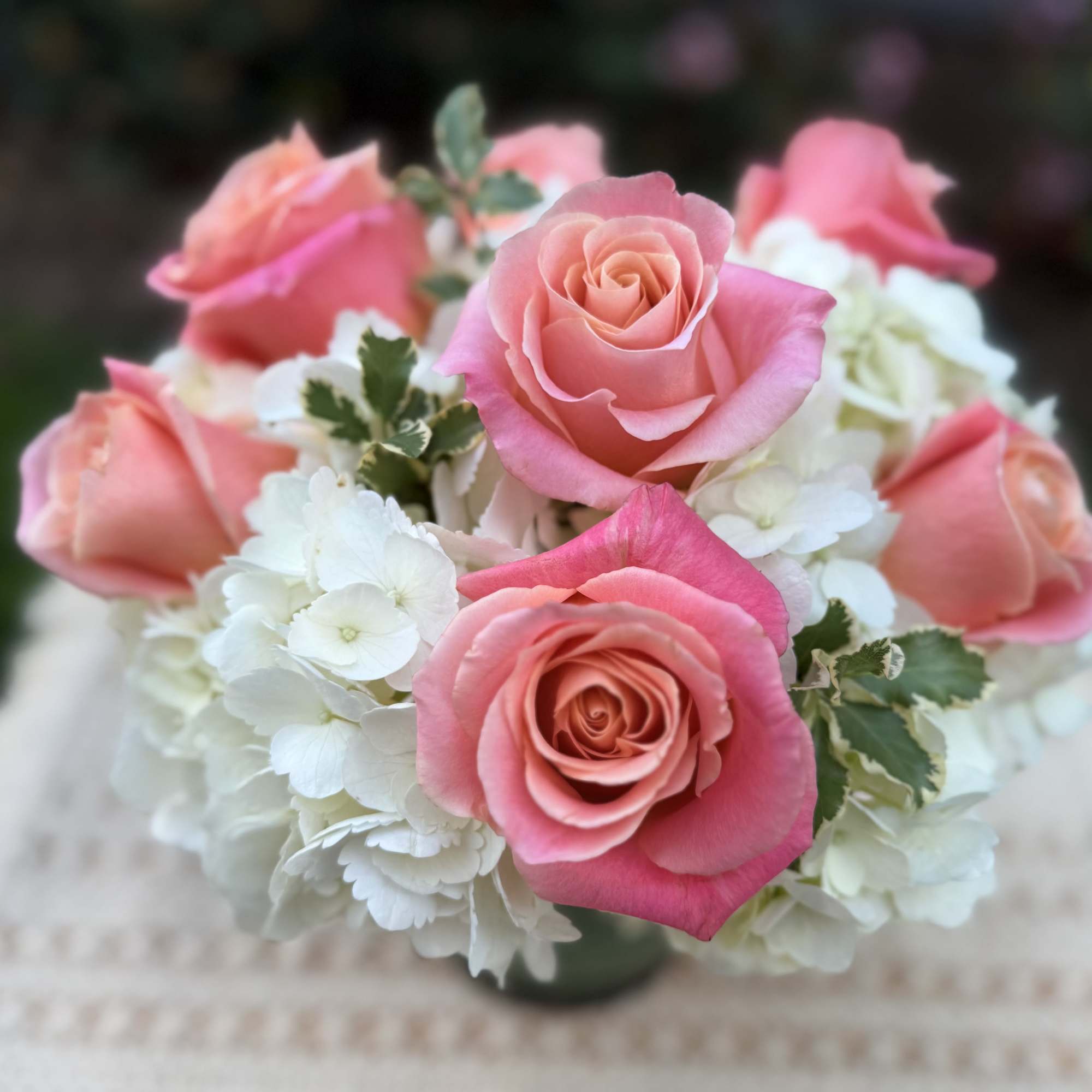 Beautiful Classic arrangenment crafted with beautiful hydrangeas and Ecuadorian roses, accented with