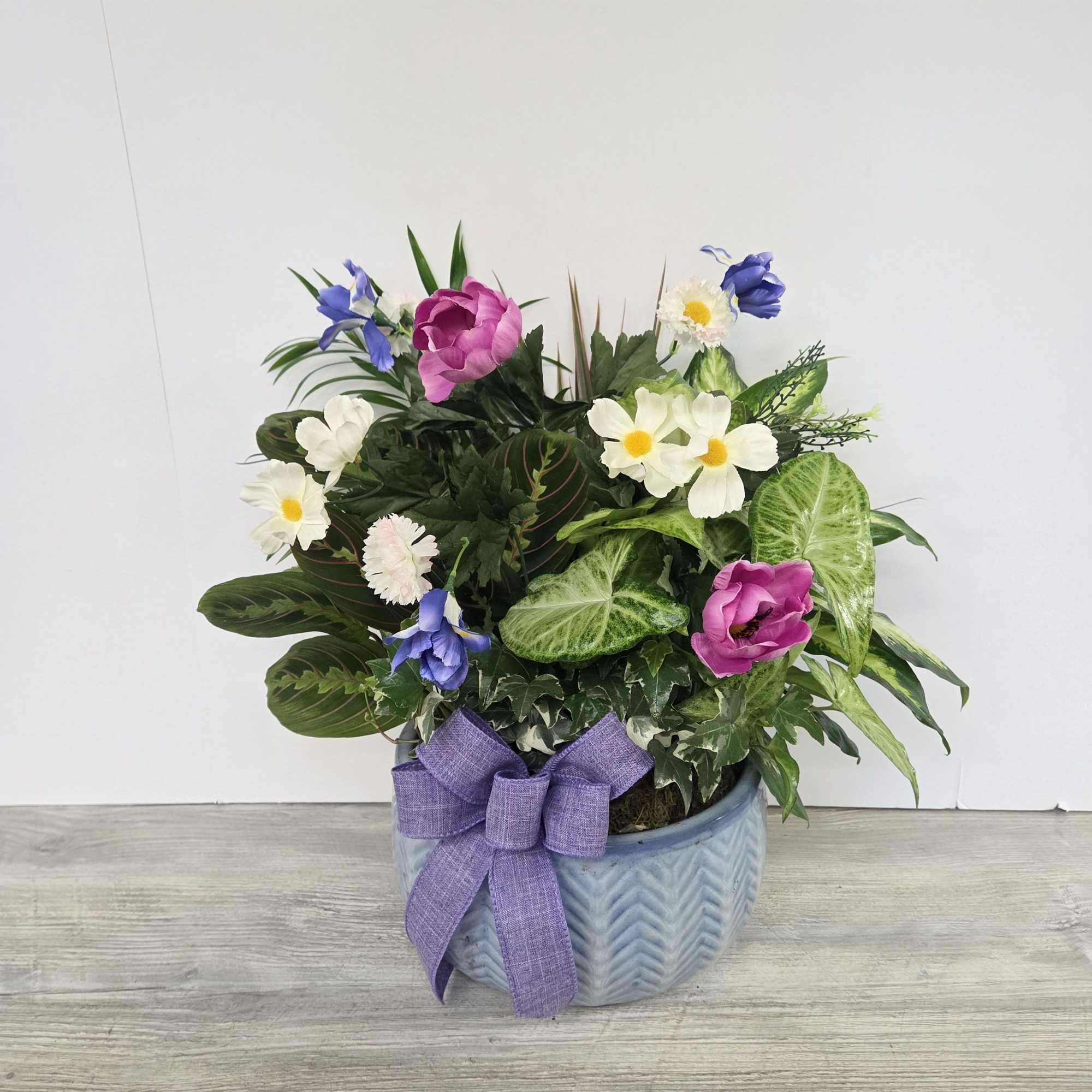 A lush combination of green plants is an exquisite gift. It's a