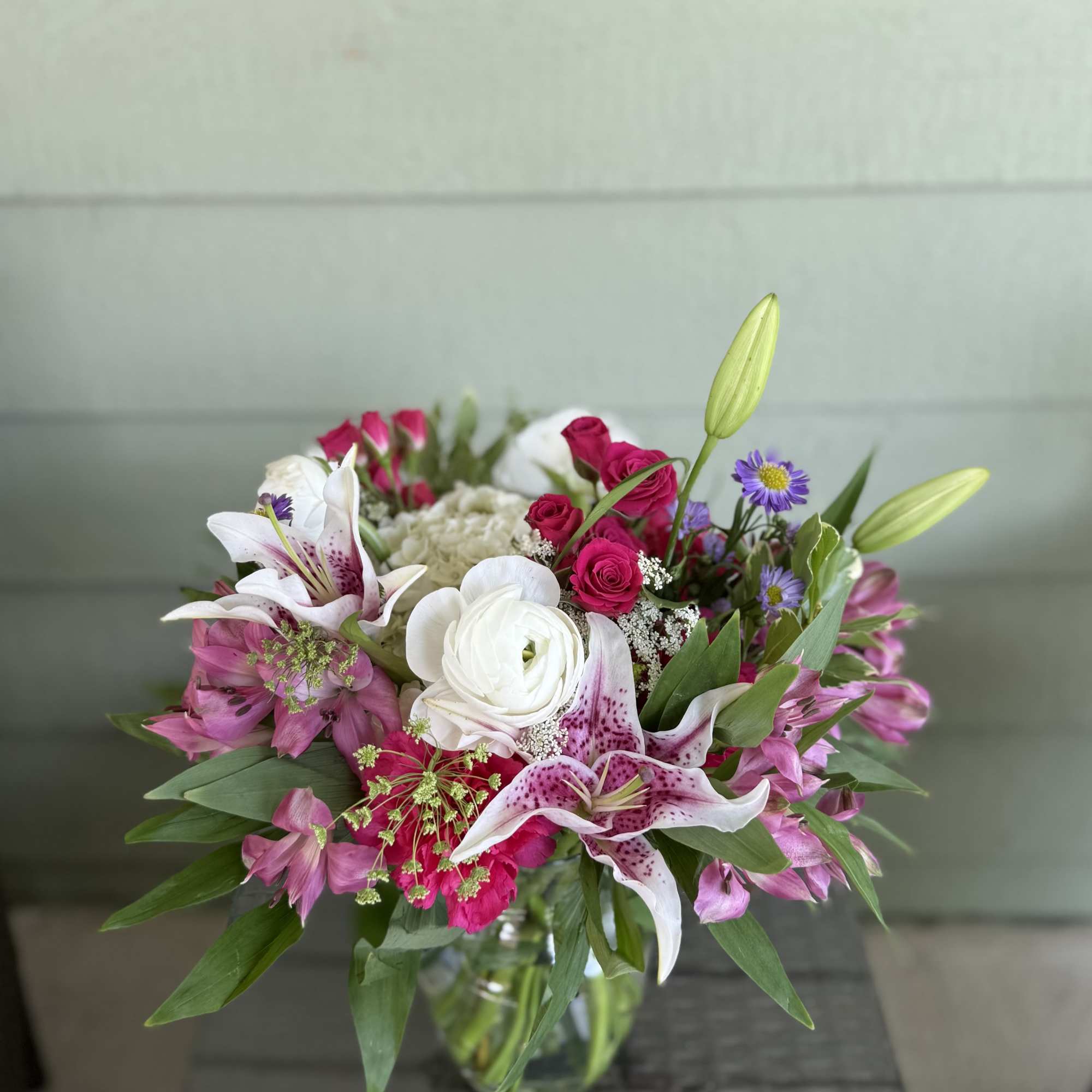 Overflowing with vibrant charm, our Blushing Radiance arrangement is a joyful expression