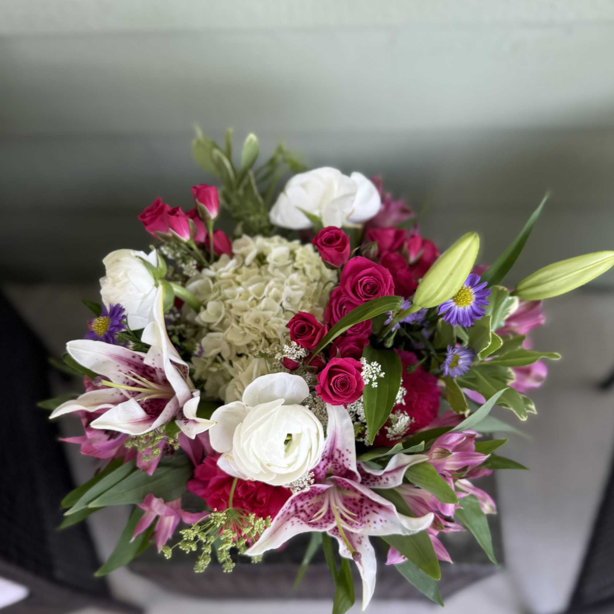 Overflowing with vibrant charm, our Blushing Radiance arrangement is a joyful expression