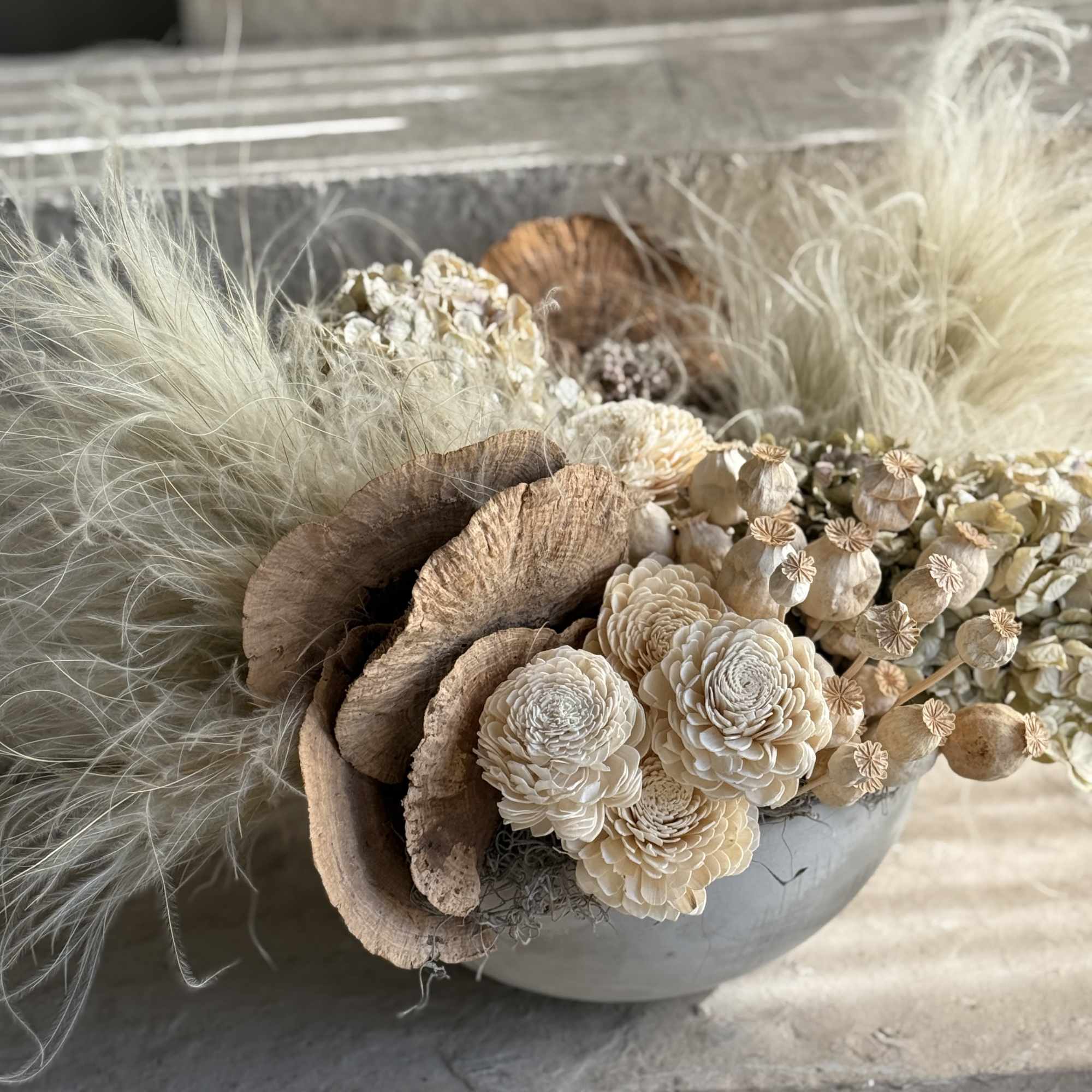 Set in a minimalist, stone-textured ceramic bowl, it features a blend of