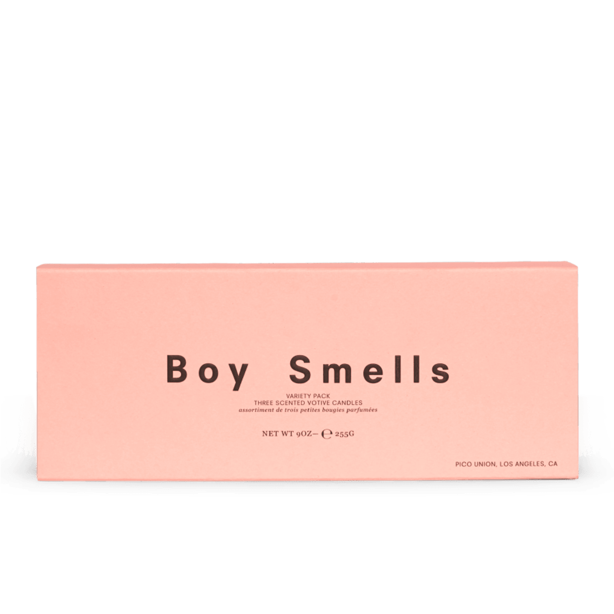 Rectangular pink box labeled Boy Smells, likely containing votive candles