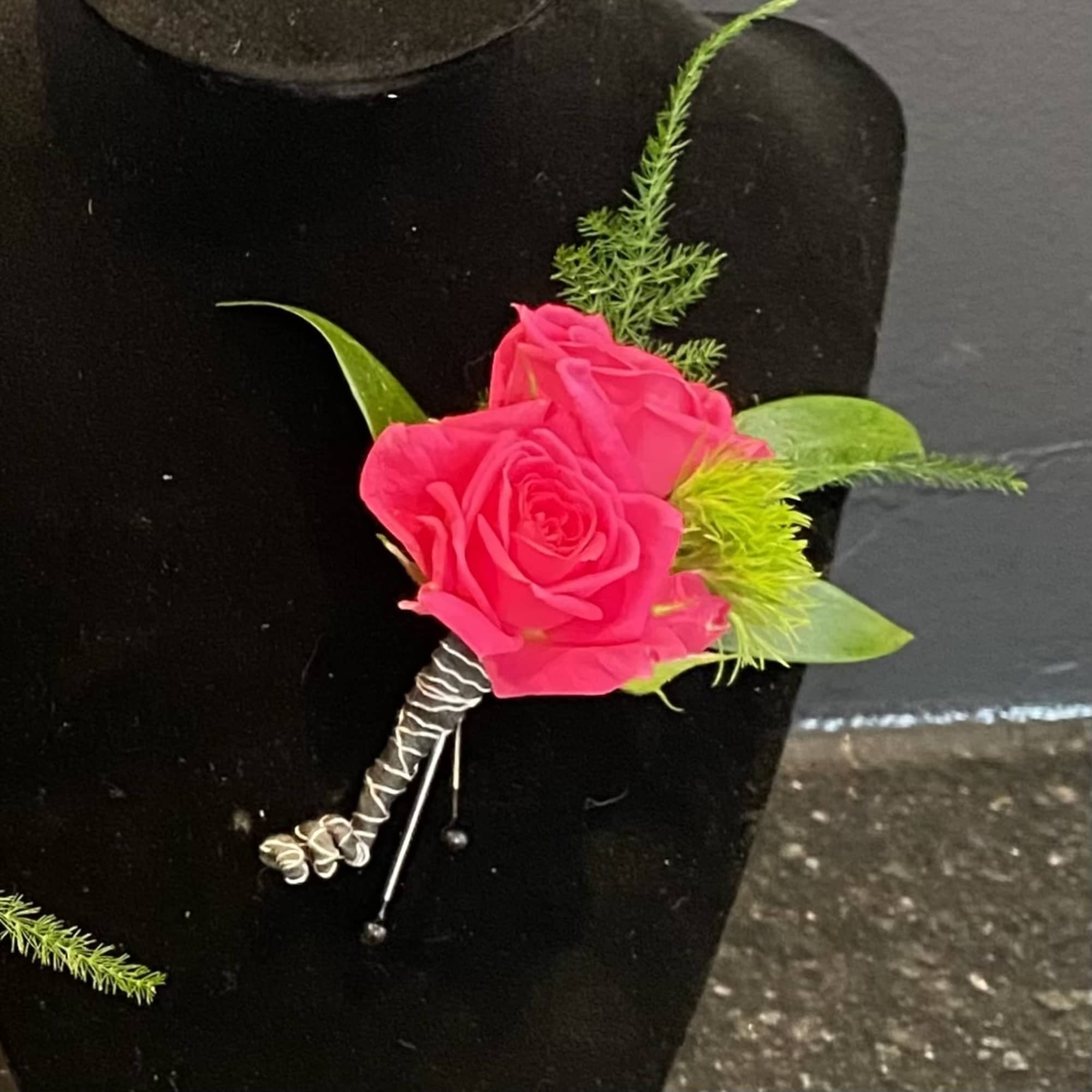 Elevate your prom attire with our elegant spray rose boutonniere.

Please note colors