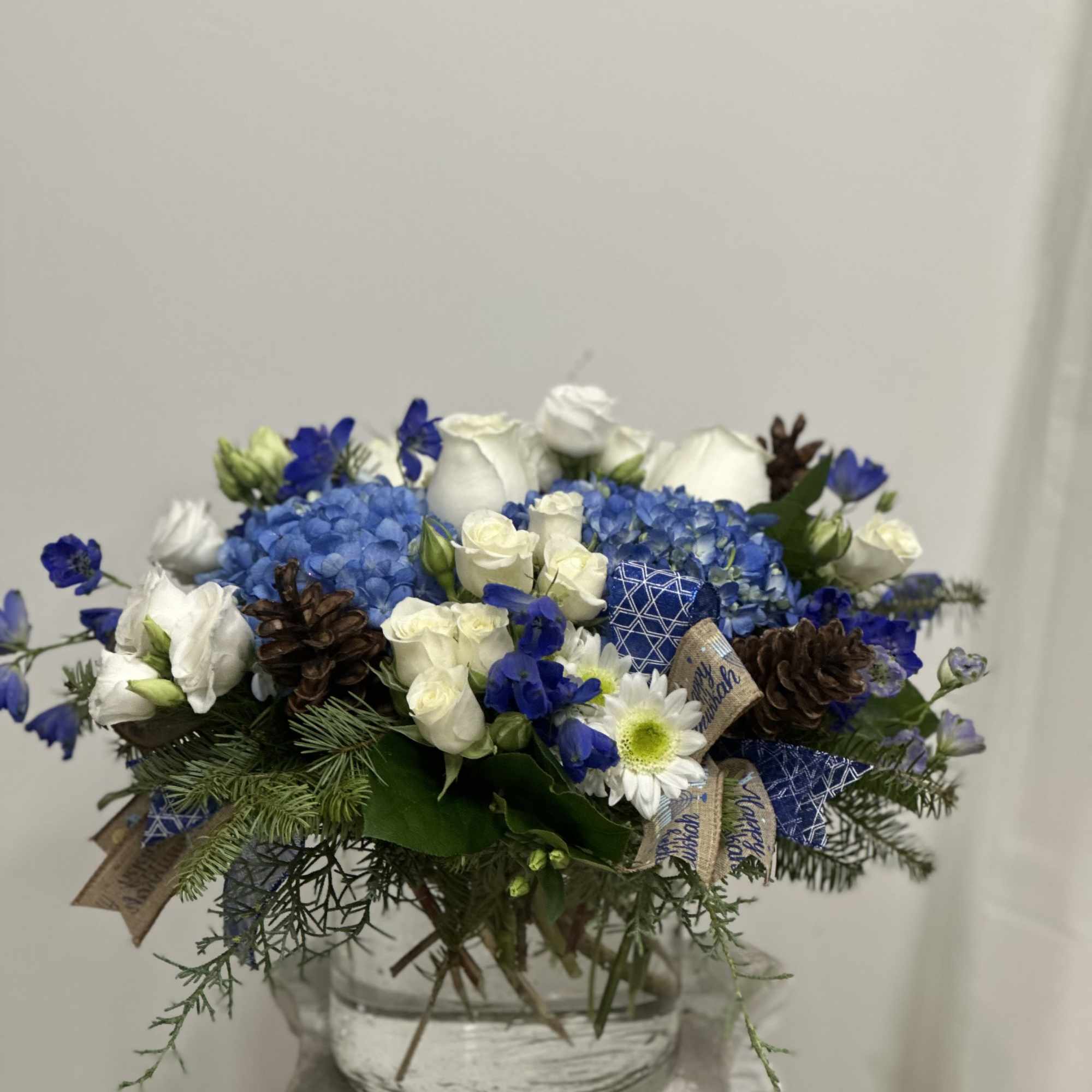 Celebrate the magic of Hanukkah with our enchanting arrangement, Hanukkah Harmony by