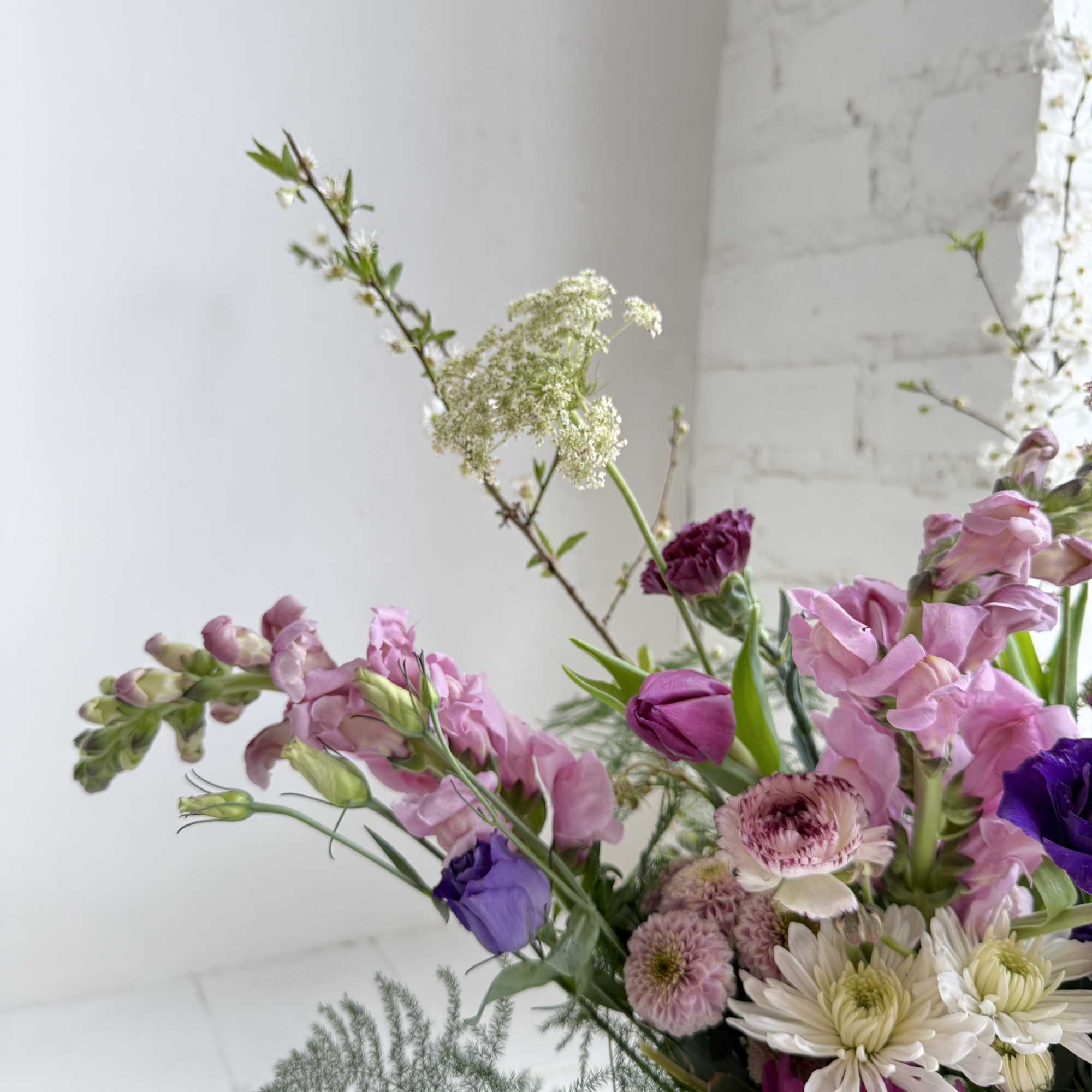 This simple but beautiful arrangement is composed with varying heights and textures.