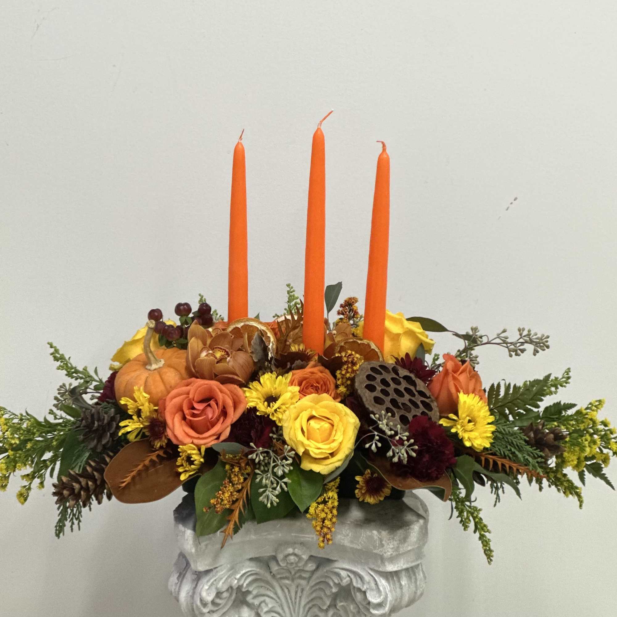 Elevate your holiday festivities with the Harvest Glow Centerpiece from Westford Florist