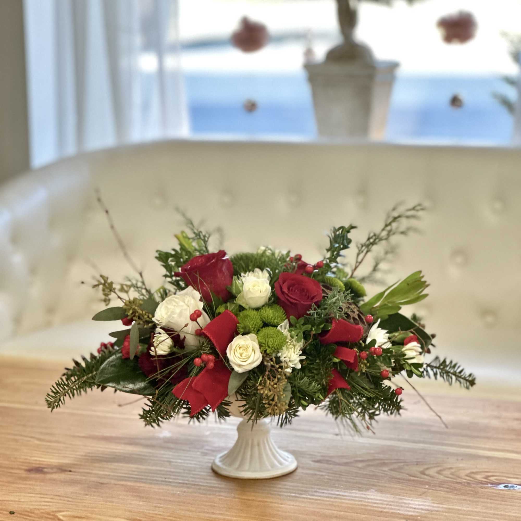 Elevate your holiday gatherings with the Holiday Harmony Centerpiece by Westford Florist
