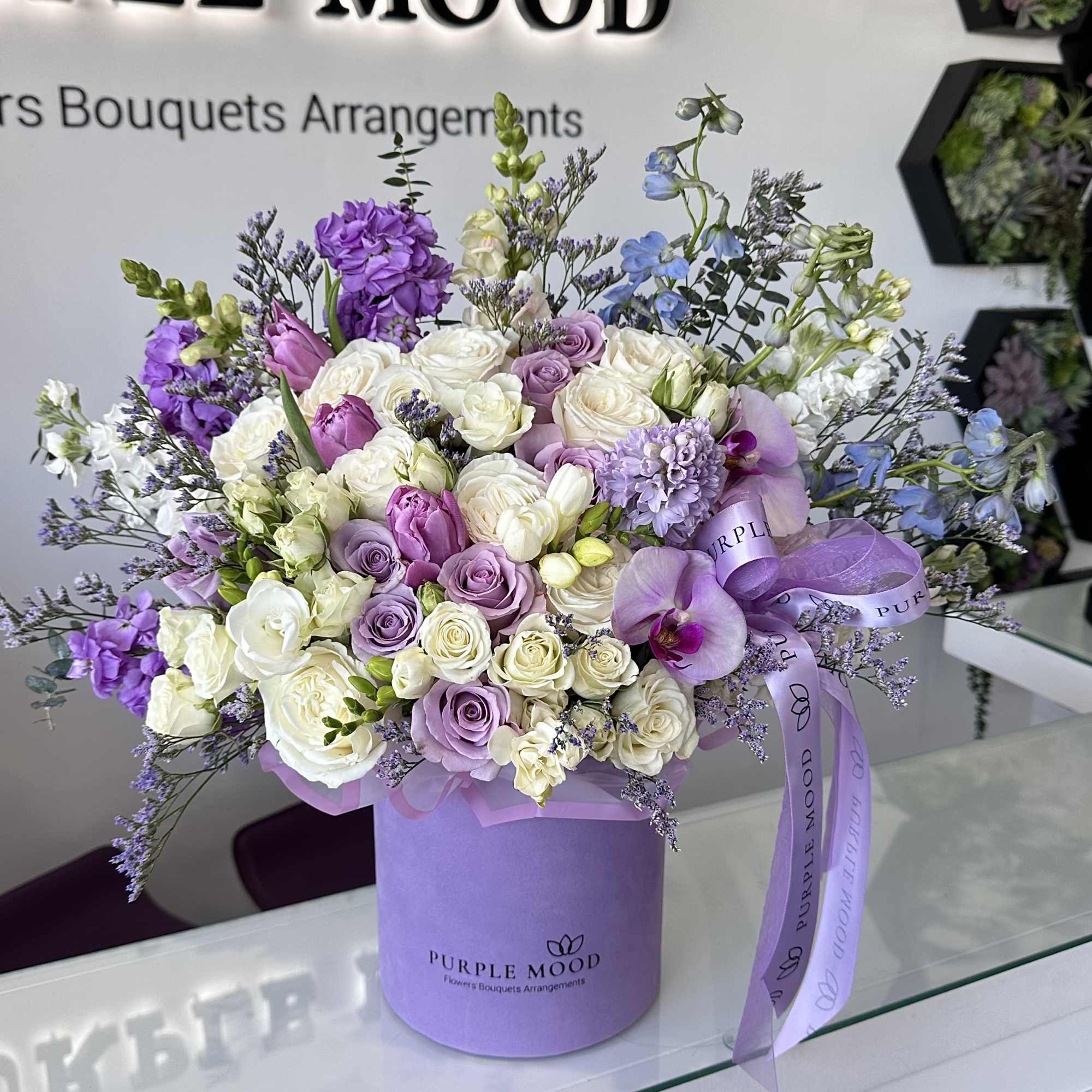 Lavender box with white and lavender flowers. 

Standard - Container size D6.75'x