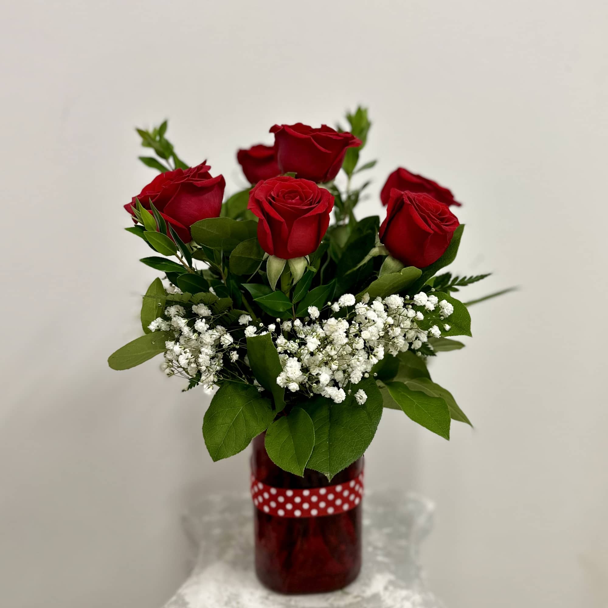 Elevate your expressions of affection with the Simply Red arrangement by Westford