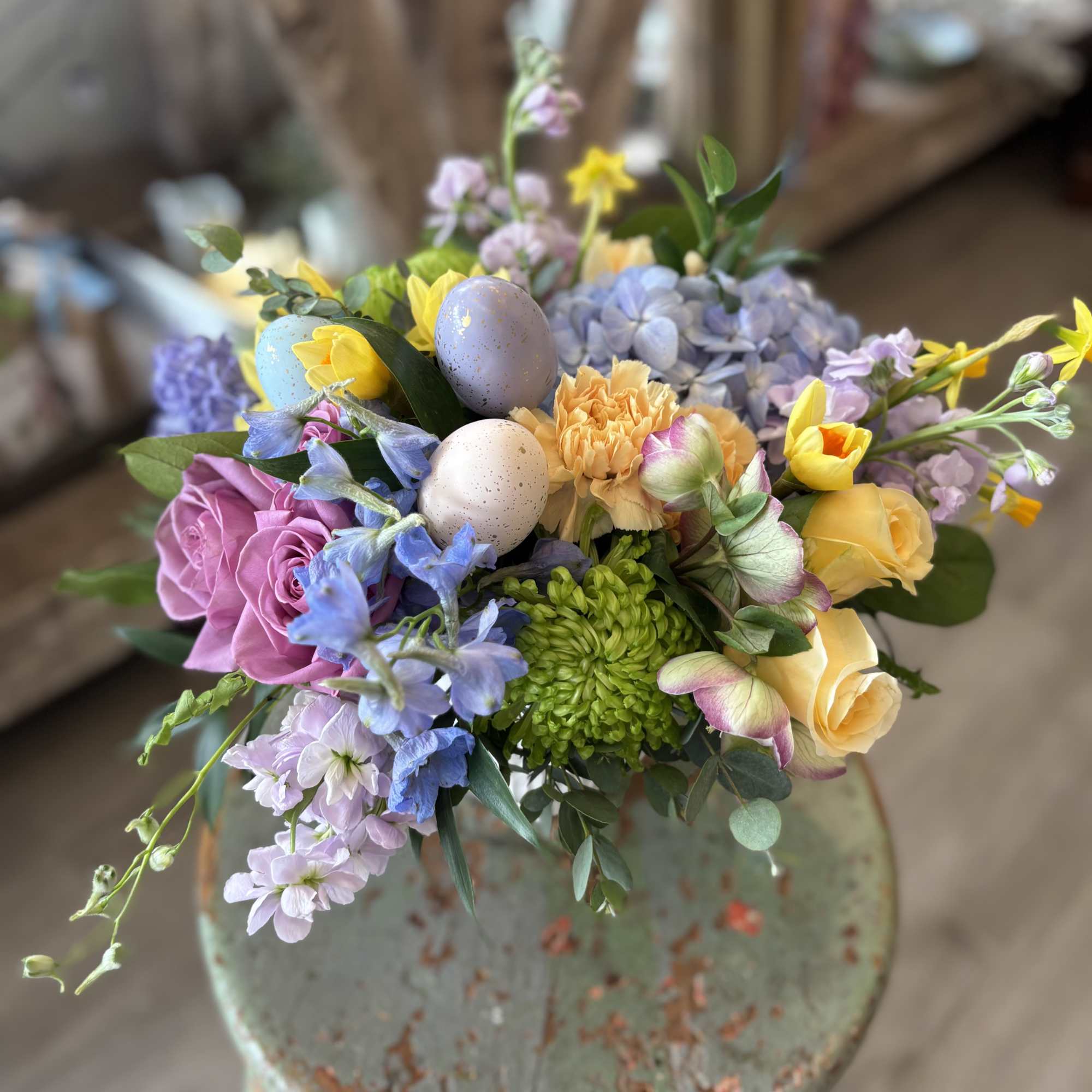 A cheerful spring arrangement in soft pastels tones featuring some of our