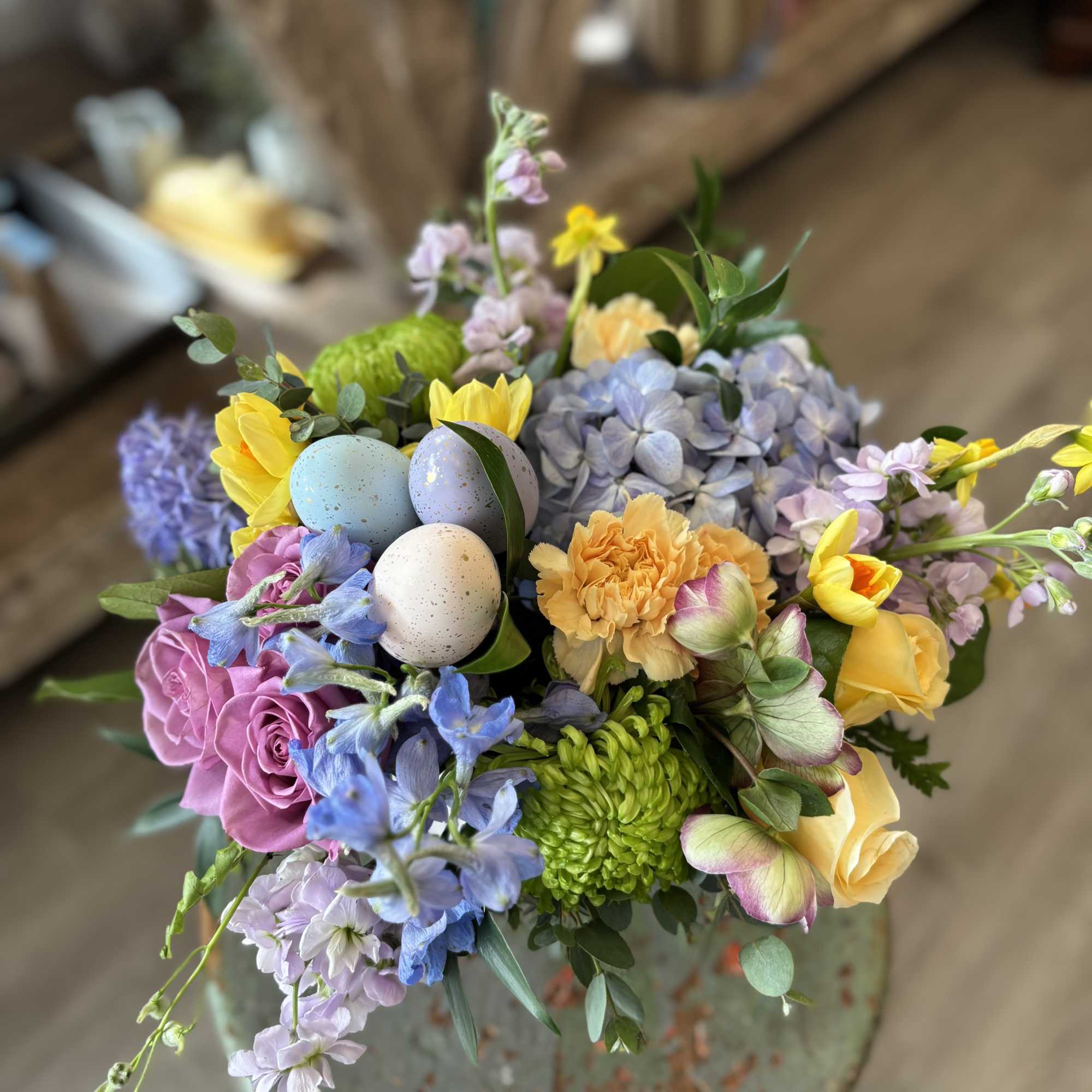 A cheerful spring arrangement in soft pastels tones featuring some of our