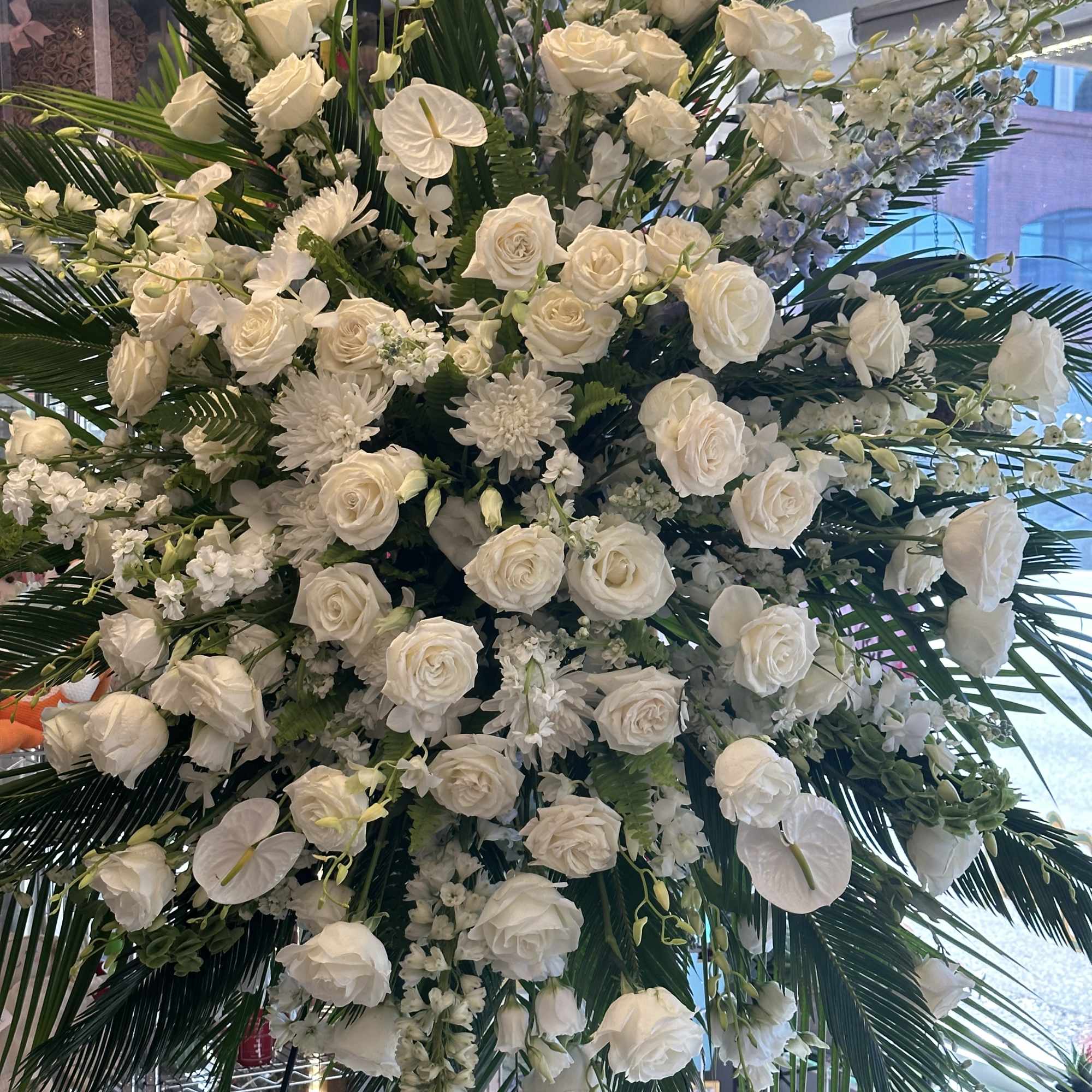 An all white tribute, this funeral spray is pure and tranquil. Featuring