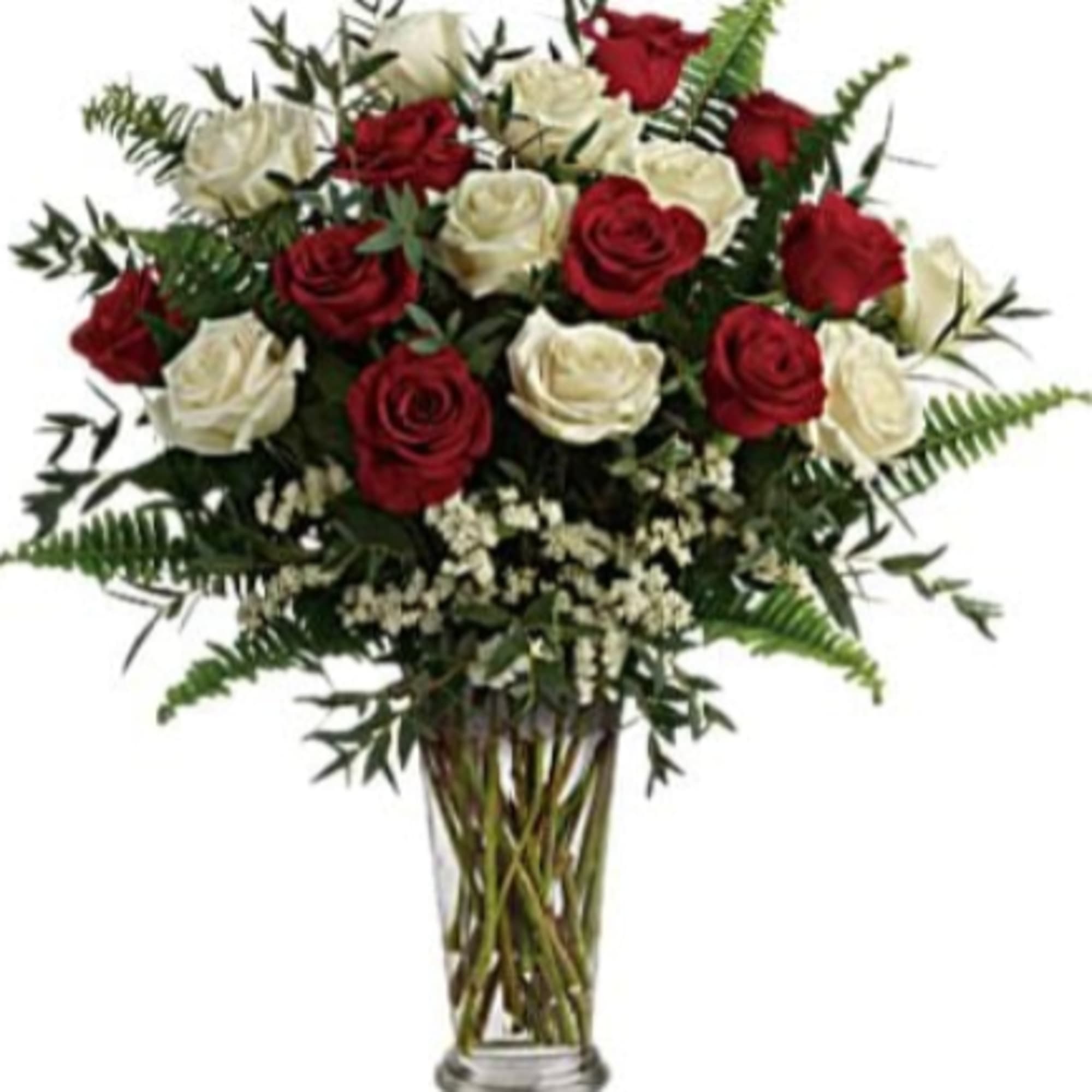 Bold red and pure white roses combine in a formal flower arrangement