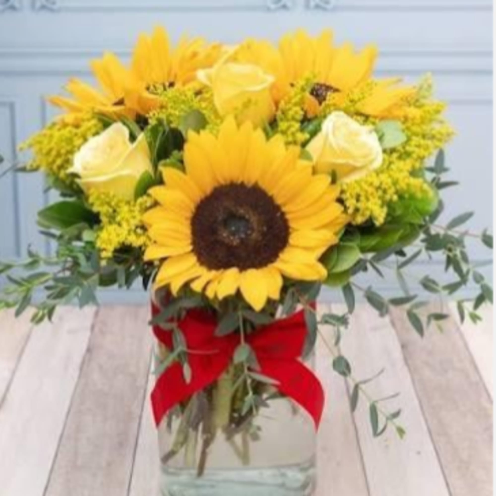 Big, golden sunflowers steal the show in this sunny bouquet-perfect as a