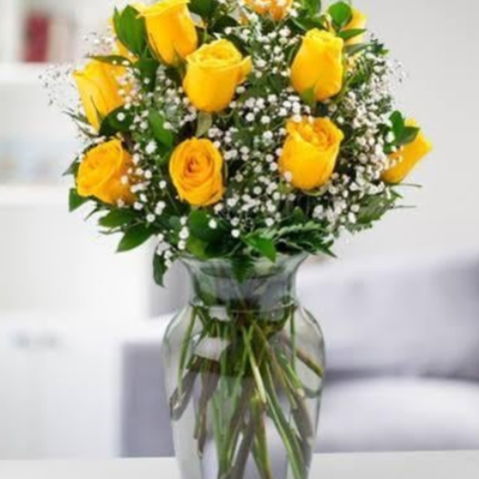 Bright yellow roses take center stage in this sunlit birthday bouquet, sympathy