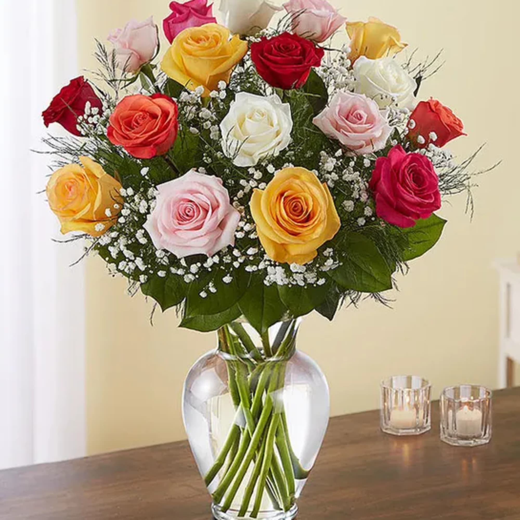 Assorted color roses in a clear glass vase. Perfect for any day