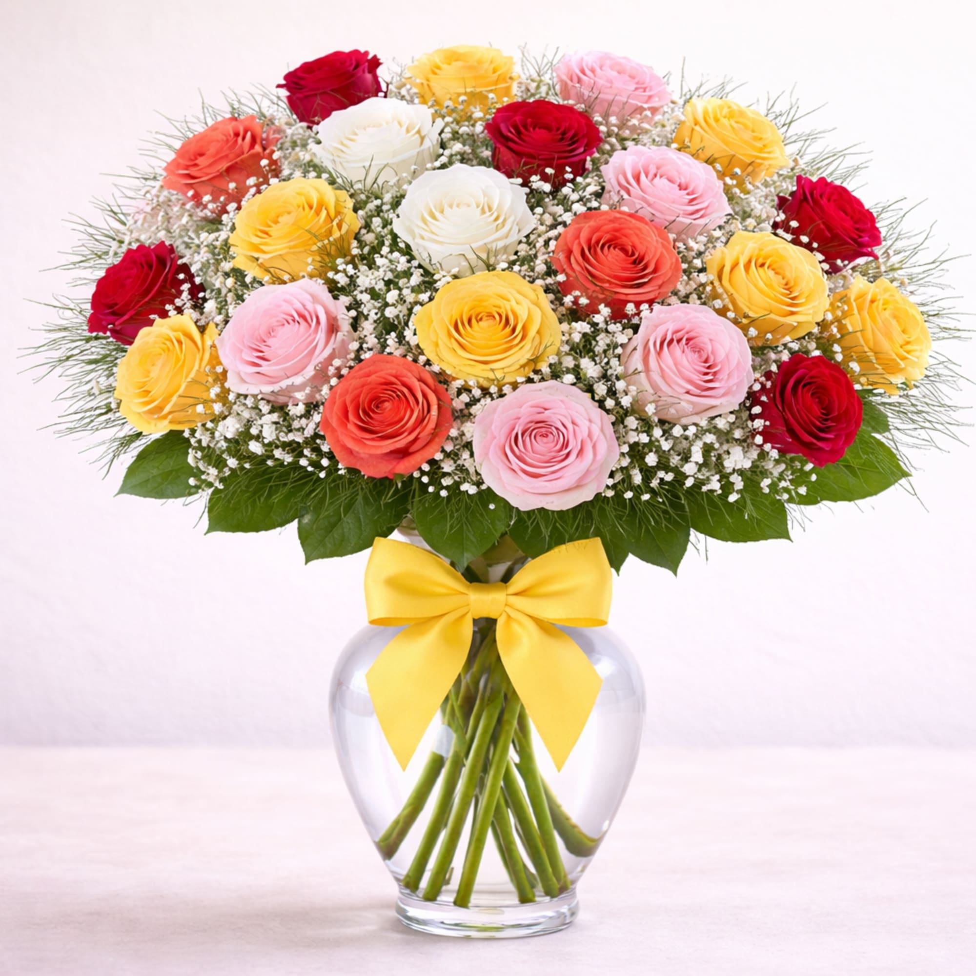 Assorted color roses in a clear glass vase. Perfect for any day