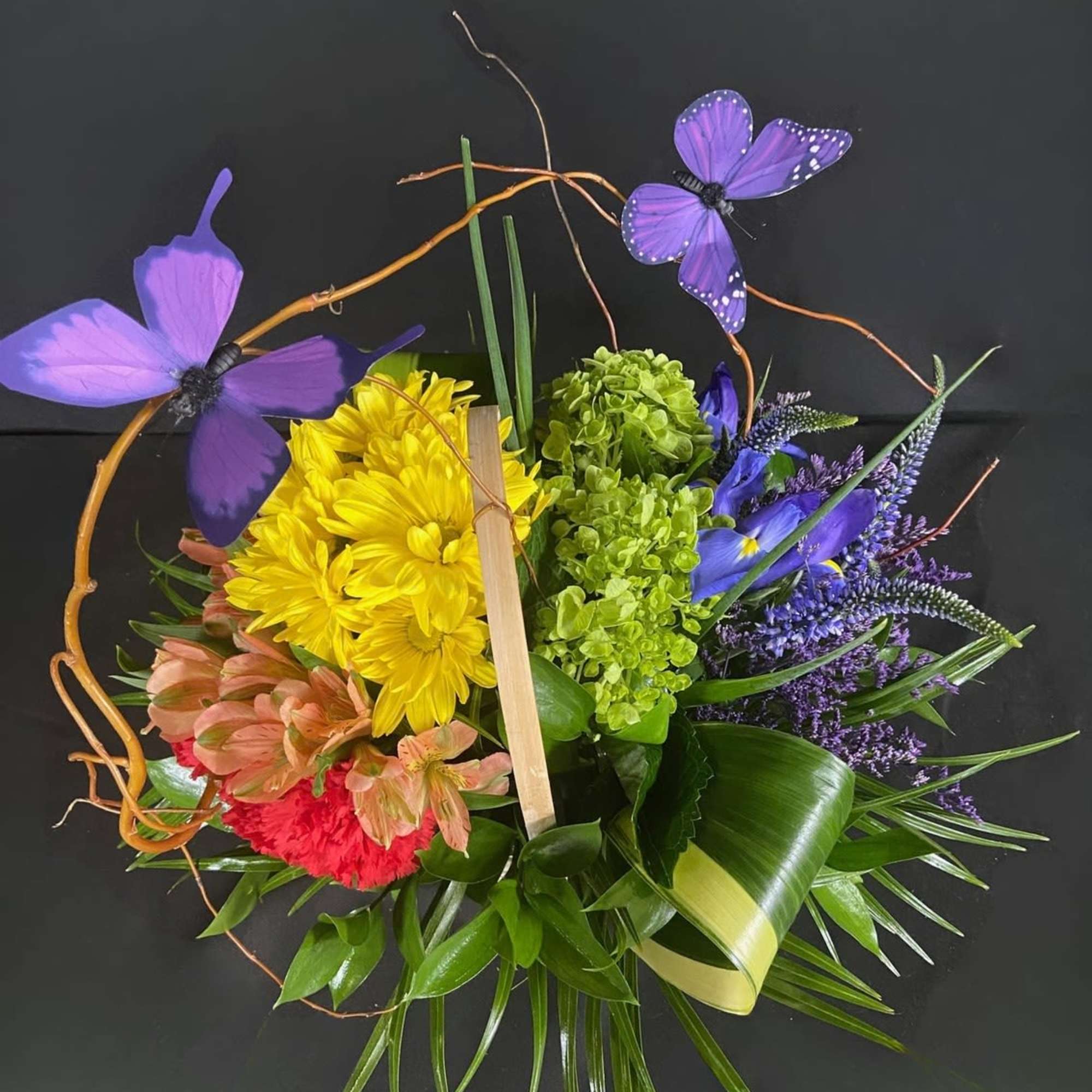 A beautiful rainbow of flowers to brighten up any space.