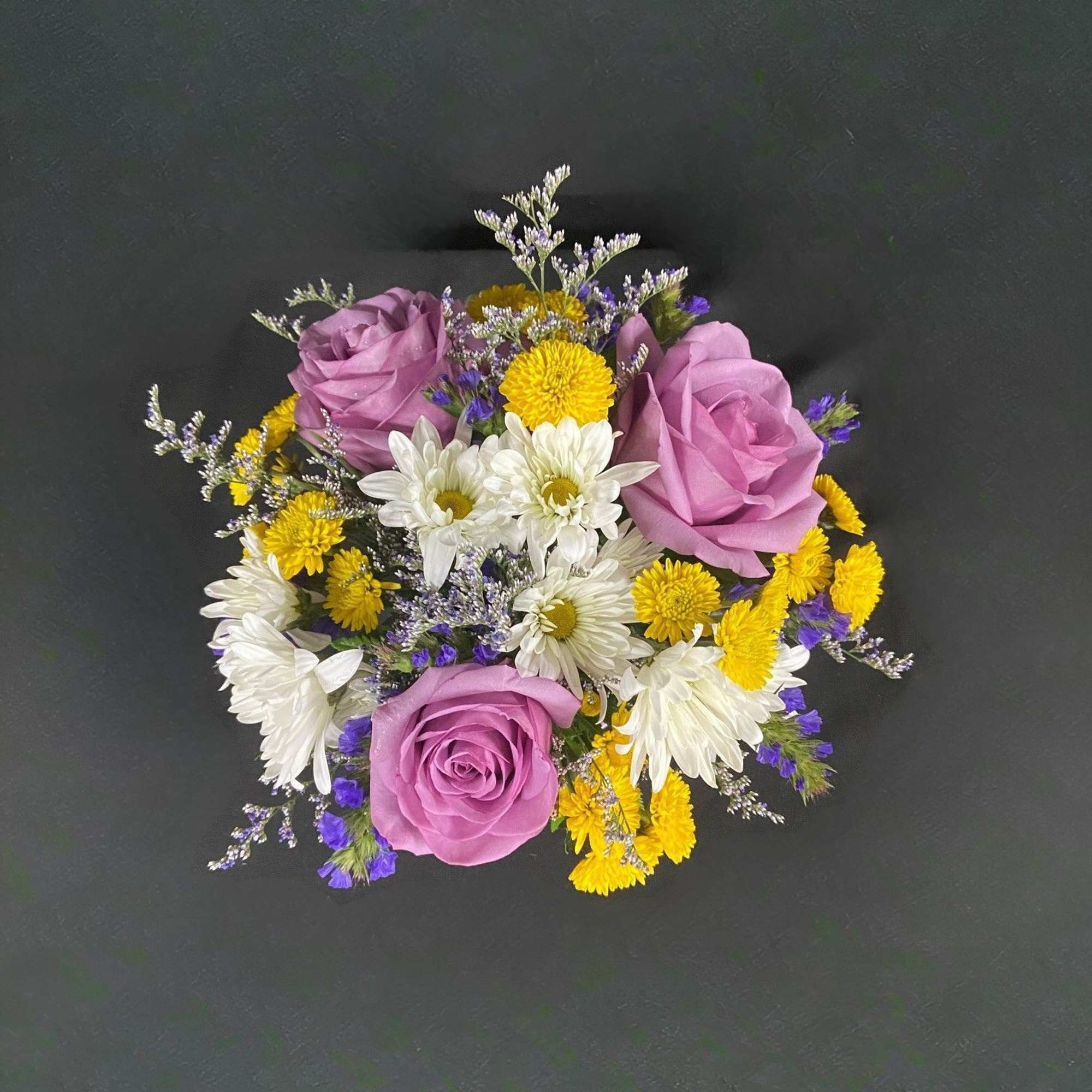 This cute metal teacup comes in several colors (Green, Purple, Orange, Red